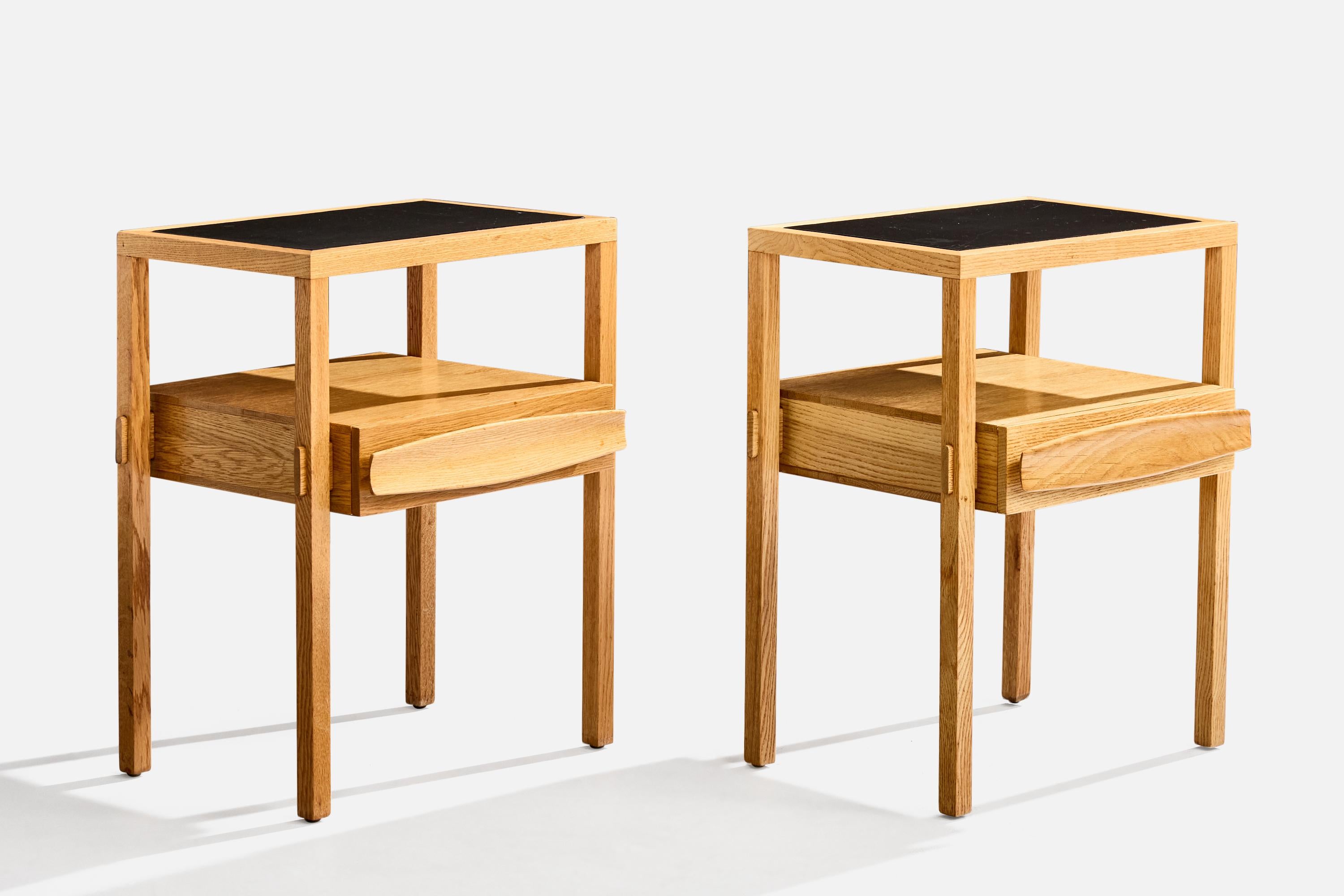 A pair of oak and black-dyed leather nightstands designed by Harold Schwartz for Romweber, USA, c. 1950s.

Overall Dimensions (inches): 28.25