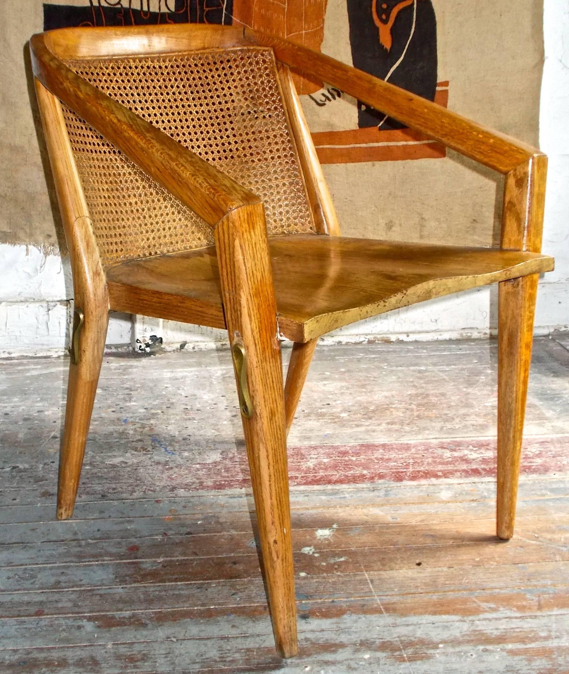 Important chair made in oak or ash with brass bracing under seat.