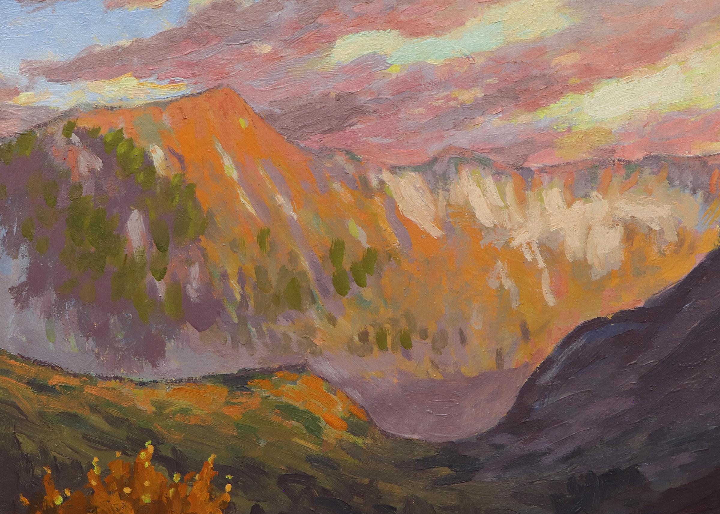 Oil on board painted in 1958 by Harold Vincent Skene (1883-1978) titled 'Mountain Sunset'. Colorado mountain autumn landscape featuring changing leaves in front of a mountain backdrop with clouds.  Presented in a custom frame, outer dimensions