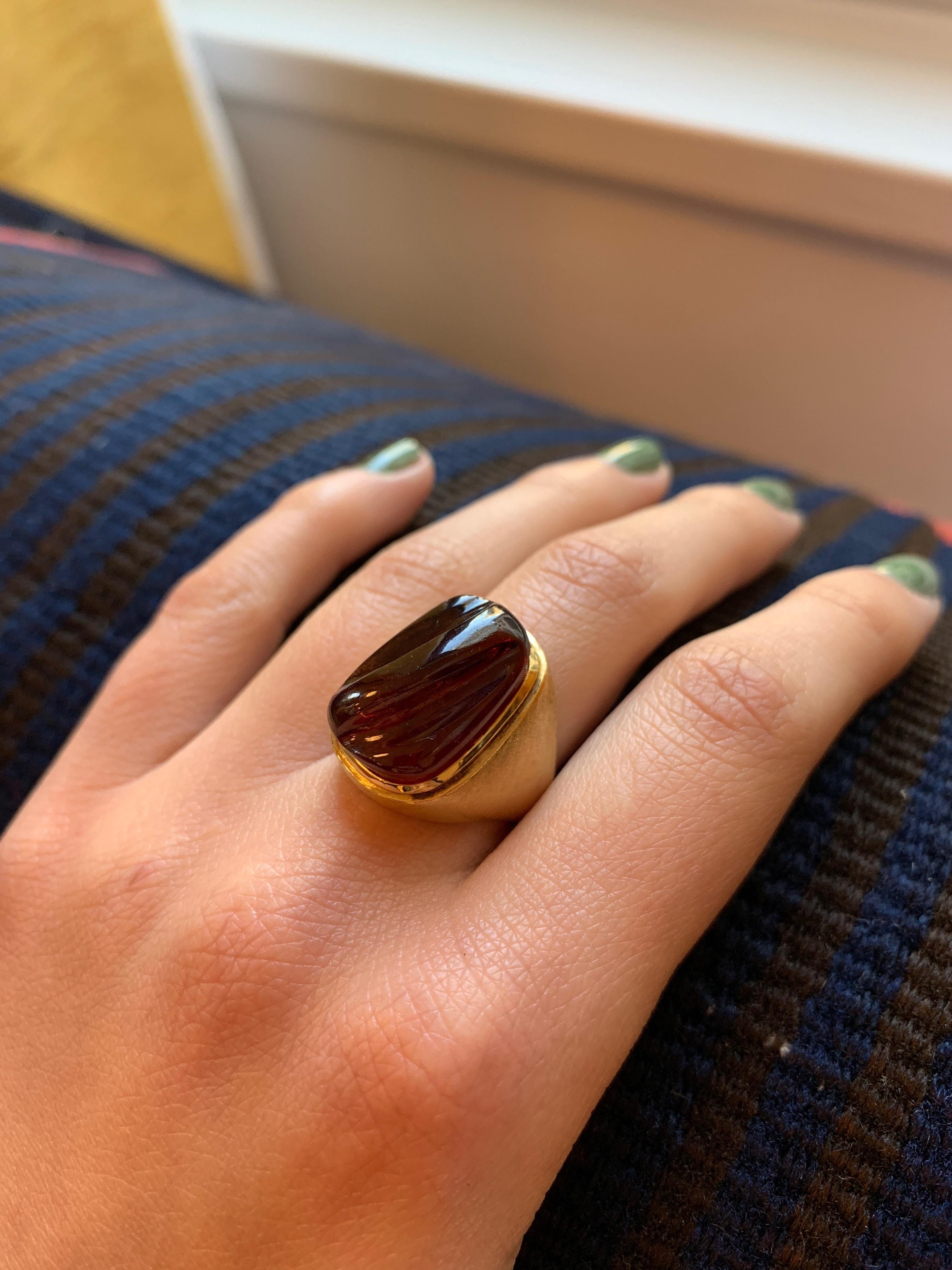 A forma livre carved rubellite and 18 karat gold ring, by Haroldo Burle Marx, c. 1970.

The ring is size 6. Signed Burle Marx. Stamped 750, IND BRAS, GB791. 
