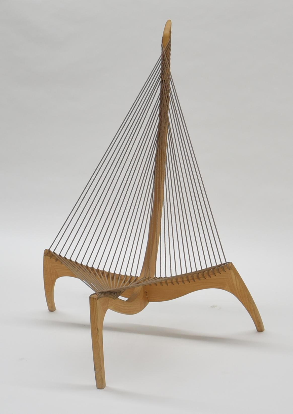 'Harp' chair by Jørgen Høvelskov.
Ash frame, seat and back with natural flag line.
Emblem with text: 'The Harp 40th anniversary JC 03260'.
Produced by Christensen & Larsen.
Dimensions: 132 (H) x 105 (W) x 113 (D) cm
Seating height 27 cm
Signs of