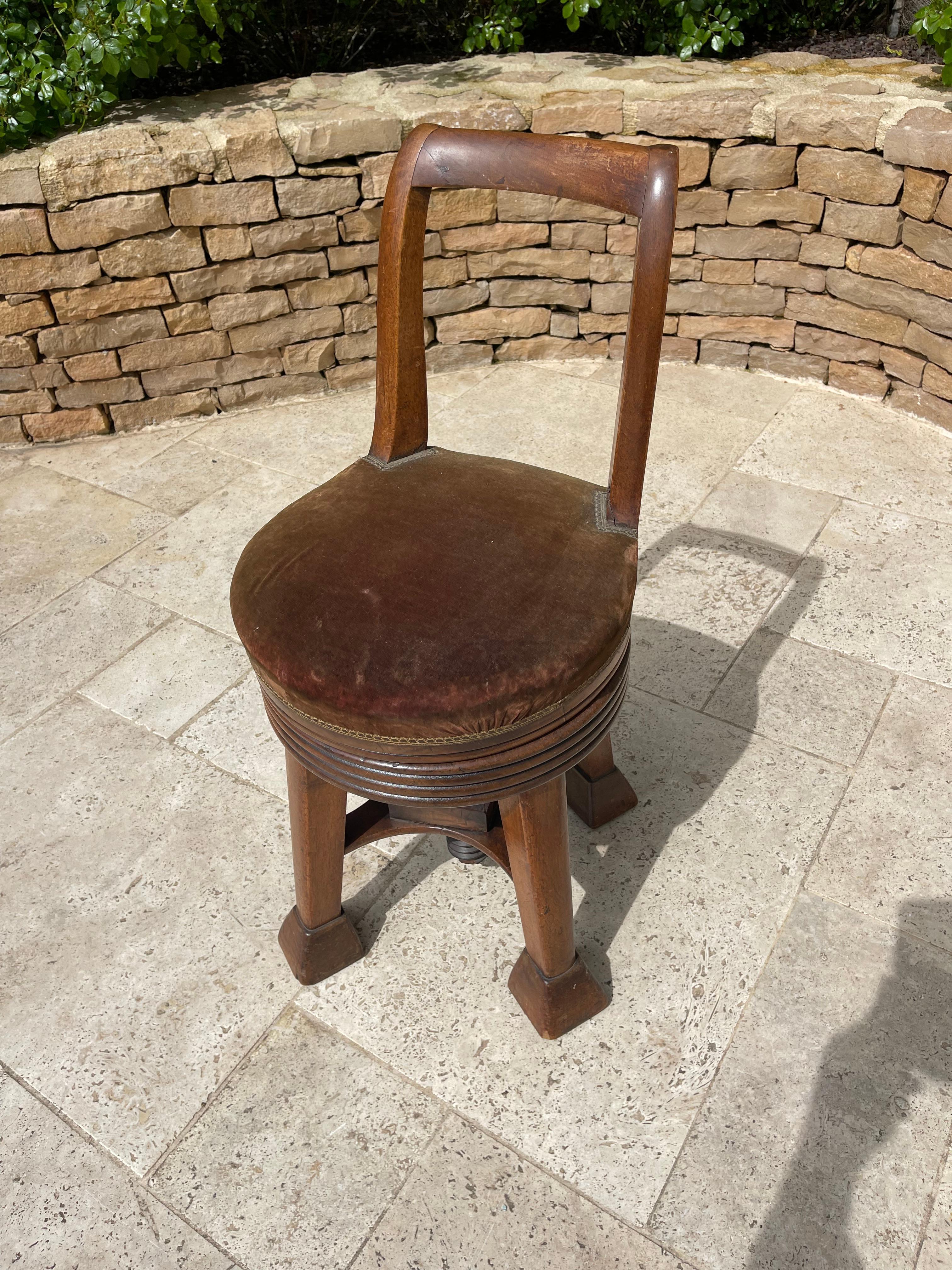 Harpist chair in solid blond mahogany. Seat in good condition covered with velvet fabric. 
 
 Dimensions
 Total height 75 cm, Seat height 46 cm, Depth 37 cm, Diameter 37 cm, Height fully raised 66 cm from the seat