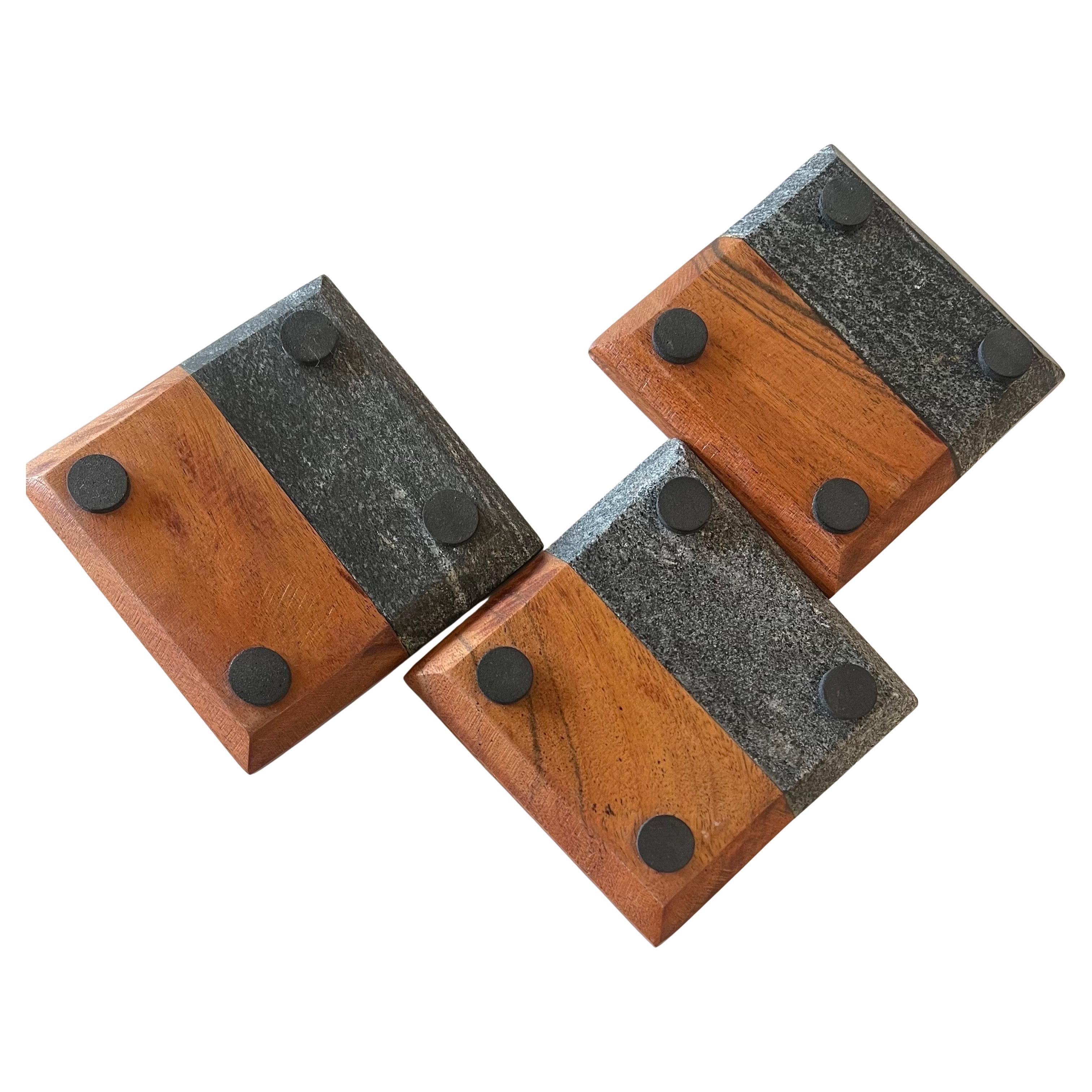 Slate and walnut set of 3 appetizer platters coasters attributed to Harpswell House. These are often attributed to Paul Evans and Phillip Lloyd Powell, however that is probably not accurate. Nonetheless, they are well made and heavy. Crafted in