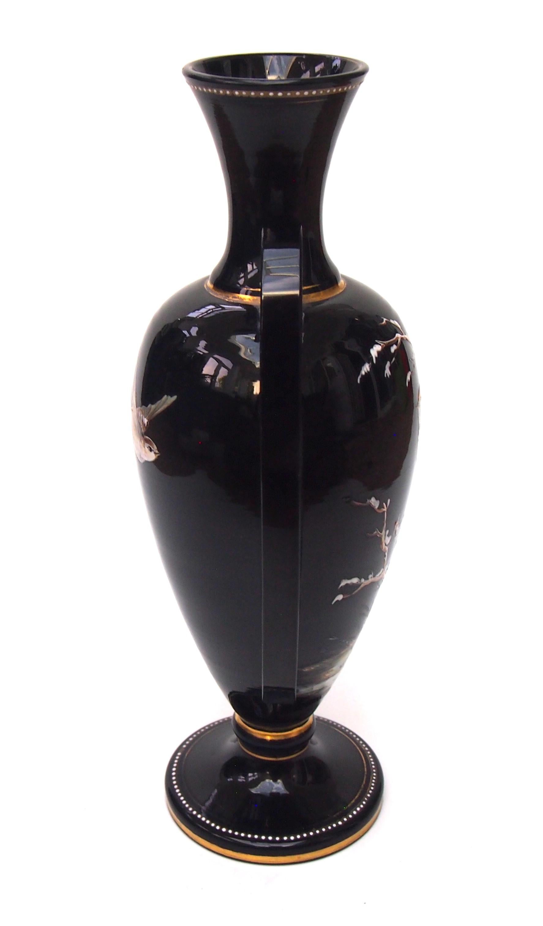 Czech Harrach Victorian black glass winged vase enamelled with birds on snowy branches For Sale