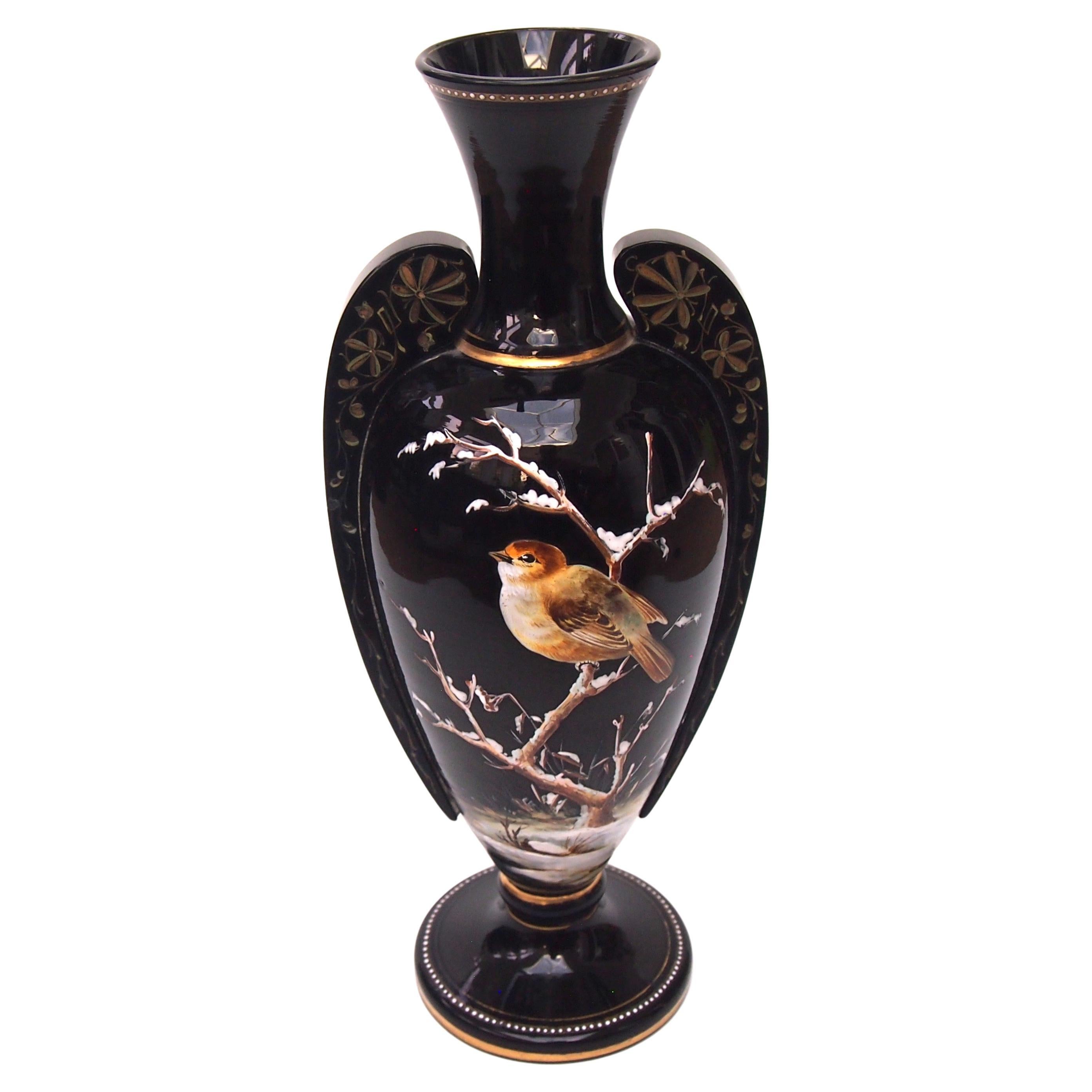 Harrach Victorian black glass winged vase enamelled with birds on snowy branches For Sale