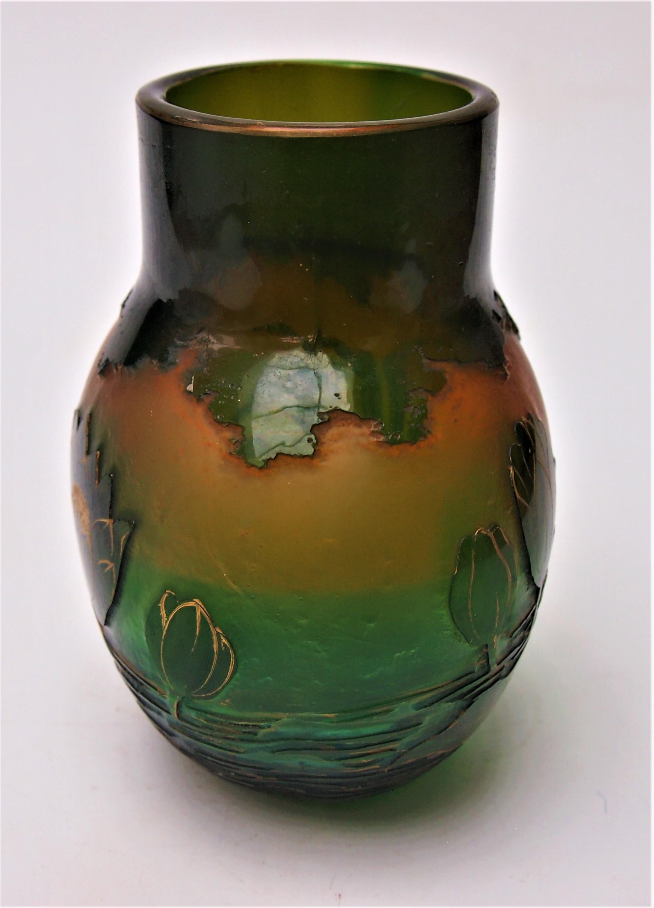 Fabulous example of a Green and Opal Orange gilded waterlily cameo vase by Harrach c1900. The vase is actually made of blue glass  cased over an opal orange -the blue sitting over the orange appears green -only in the last picture can you see hints