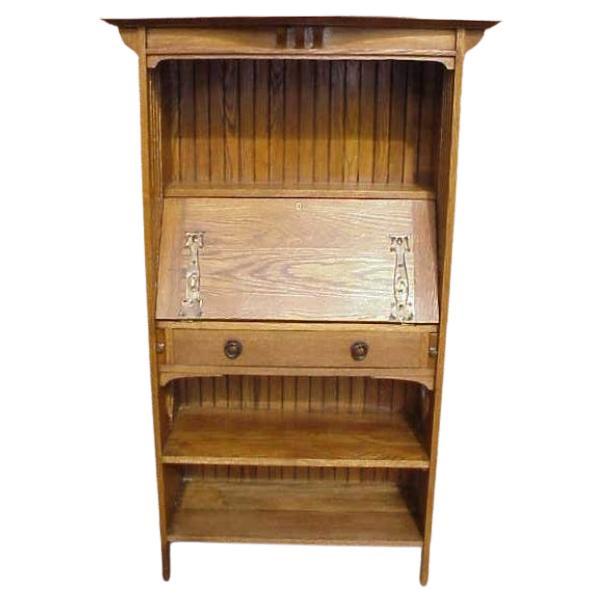 Harris Lebus. An Arts and Crafts bureau bookcase in the Glasgow Style