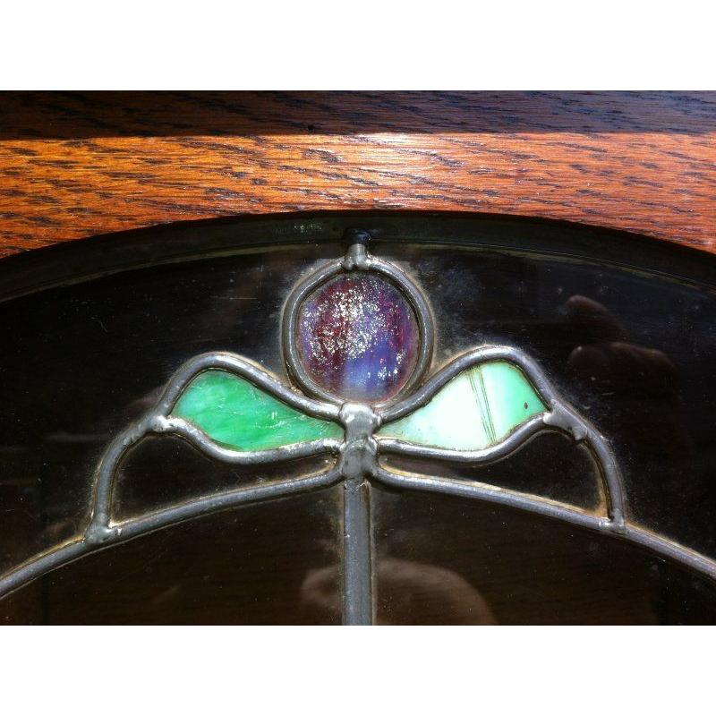 Early 20th Century Harris Lebus, Attributed. Arts and Crafts Oak sideboard with Glasgow Style glass For Sale