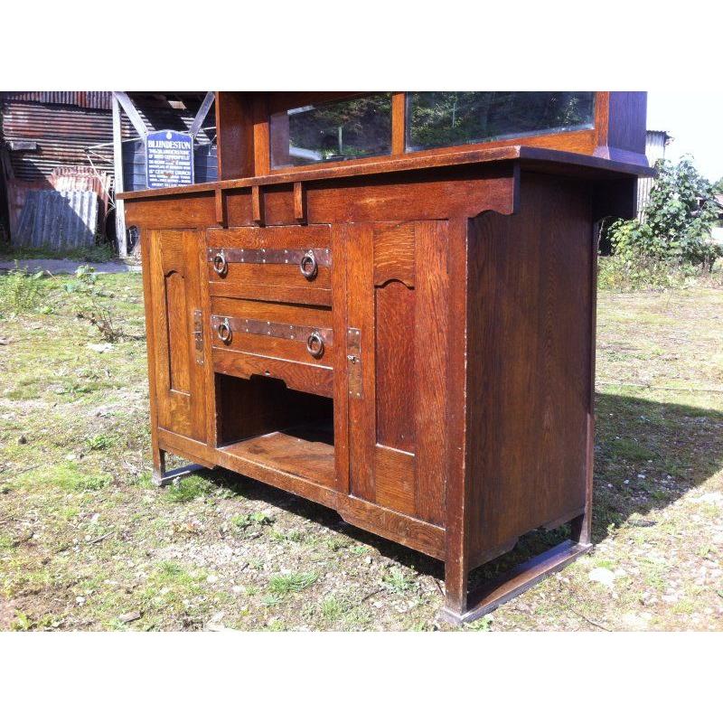 Harris Lebus, Attributed. Arts and Crafts Oak sideboard with Glasgow Style glass For Sale 4