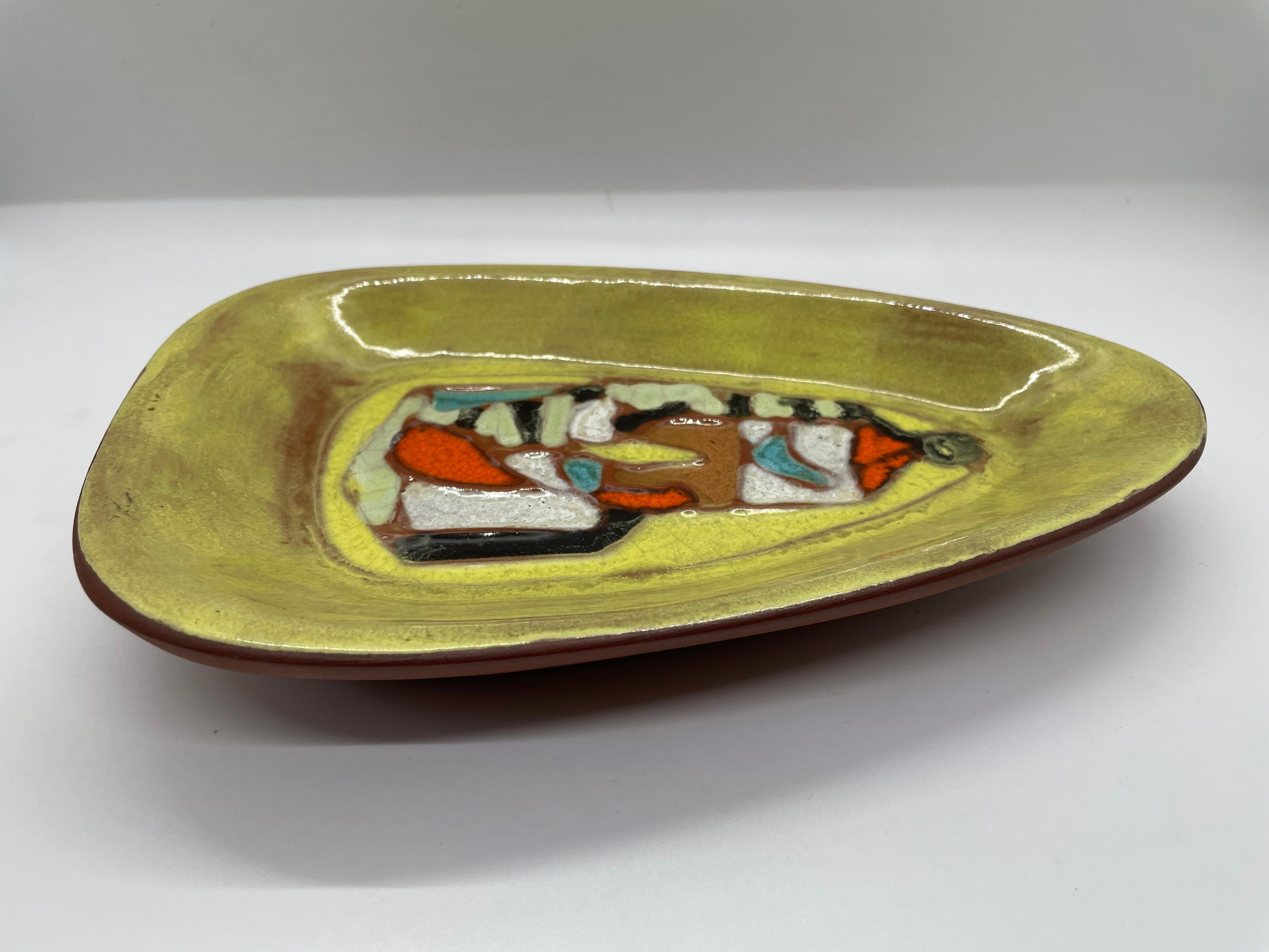 Unique shape, great colors and fabulous glaze makes this Harris Strong mid century ceramic dish a perfect accent piece!.