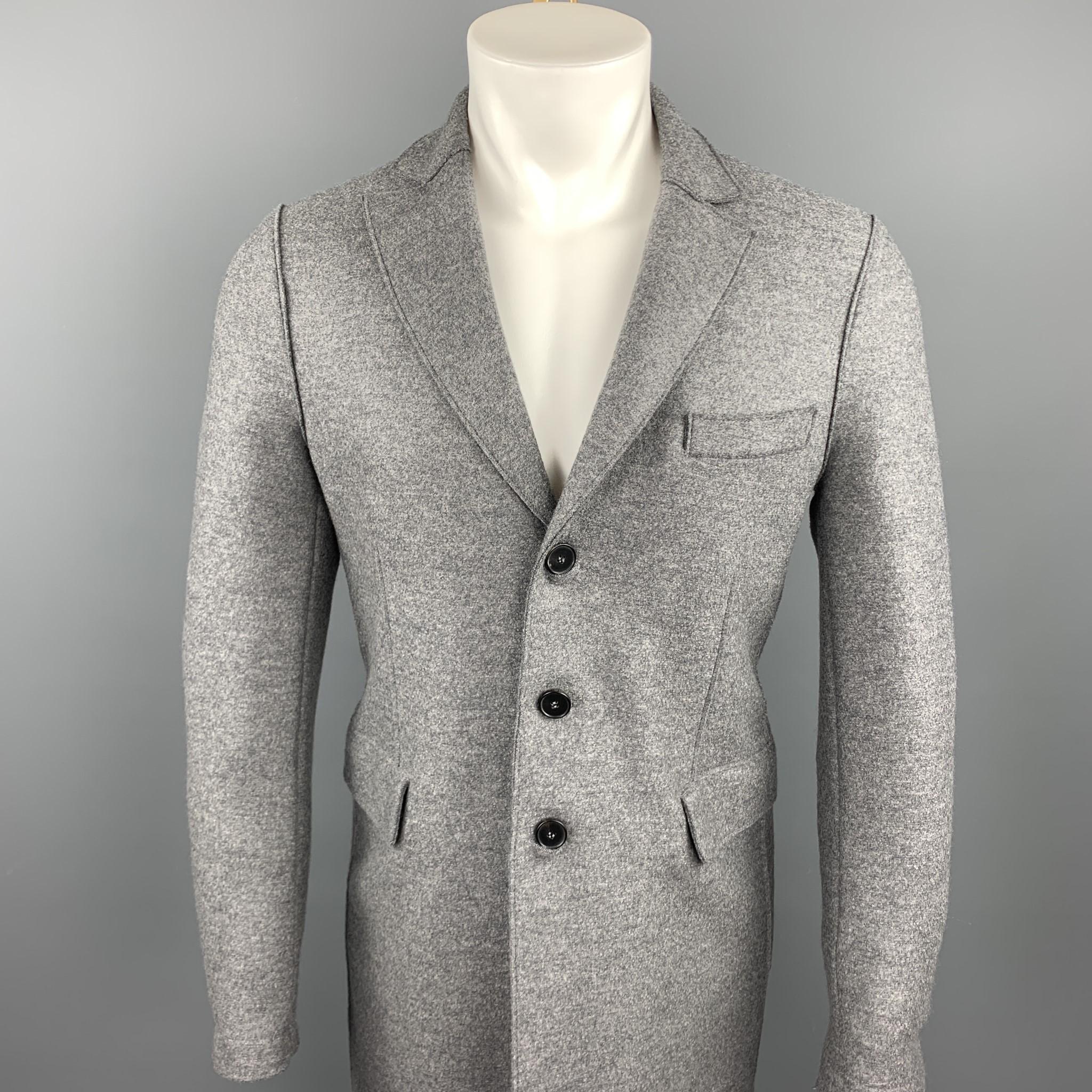 HARRIS WHARF LONDON coat comes in a gray heather wool featuring a notch lapel style, flap pockets, and a buttoned closure. Made in England.

Excellent Pre-Owned Condition.
Marked: 46

Measurements:

Shoulder: 16.5 in.
Chest: 38 in. 
Sleeve: 27.5 in.