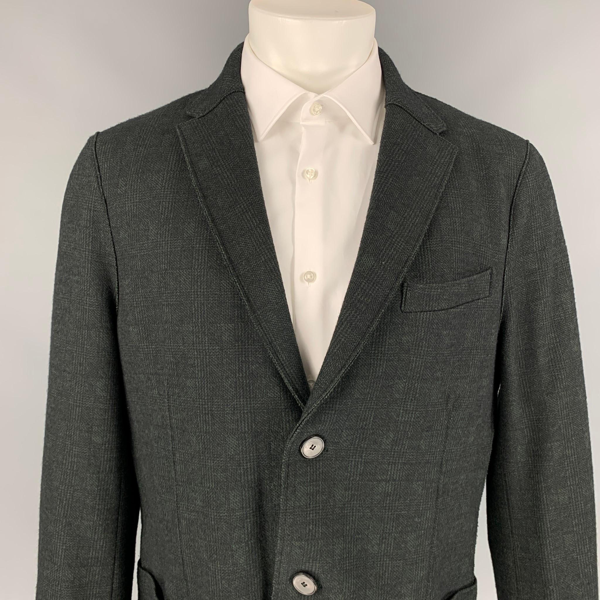HARRIS WHARF LONDON sport coat comes in a green & black plaid wool / cotton featuring a notch lapel, patch pockets, and a double button closure. Made in England. 

Excellent Pre-Owned Condition.
Marked: 54

Measurements:

Shoulder: 18.5 in.
Chest: