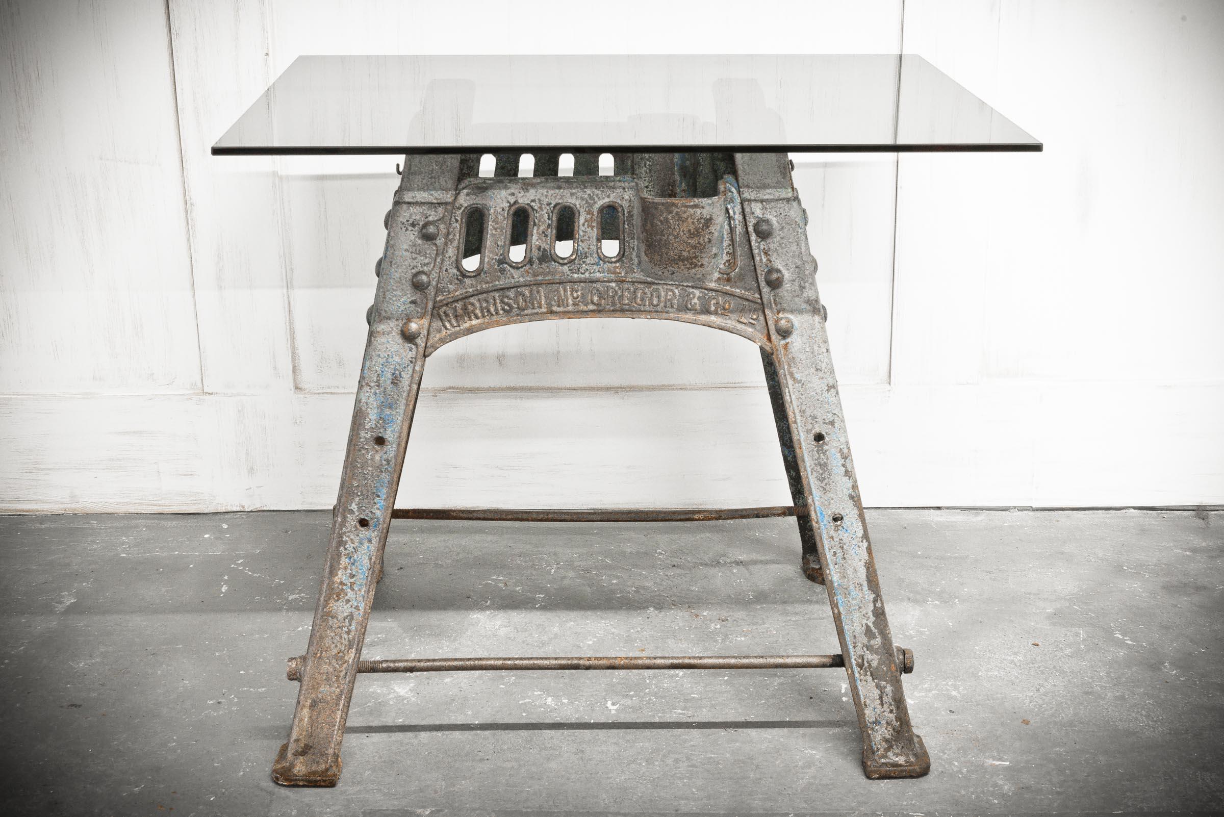 Cast iron base off a work bench from Harrison McGregor & Co with a glazed table top. Albion harvesting machines became one of the two or three leading brands in Britain during the late nineteenth and early twentieth century. Henry Harrison and