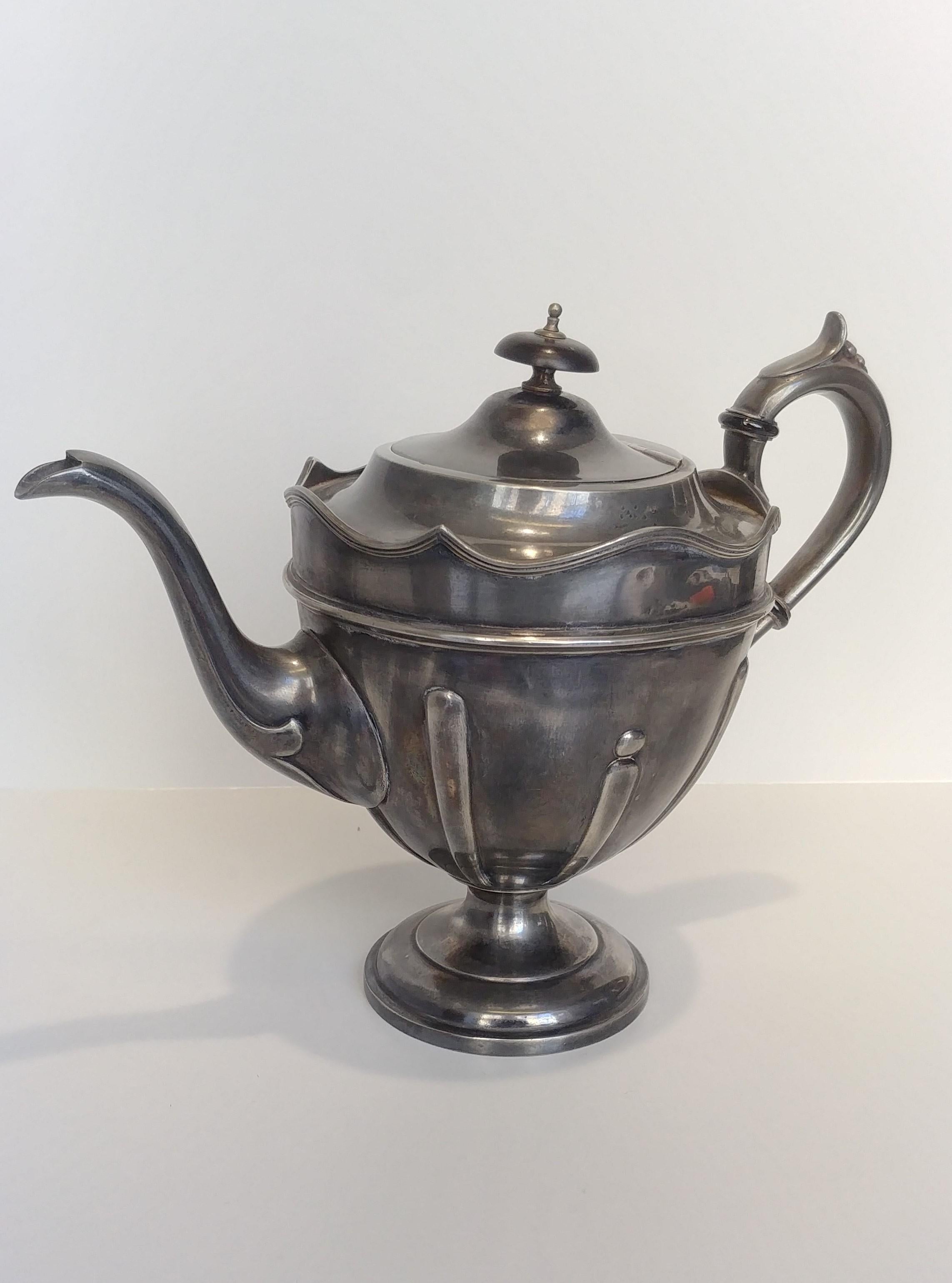Harrison Fisher & Company pewter teapot made in 1915.
English pewter teapot in Art Nouveau style made in the famous Harrison Fisher & Company factory in 1915.
Originally the teapot was covered in silver, this attests to its antiquity and the