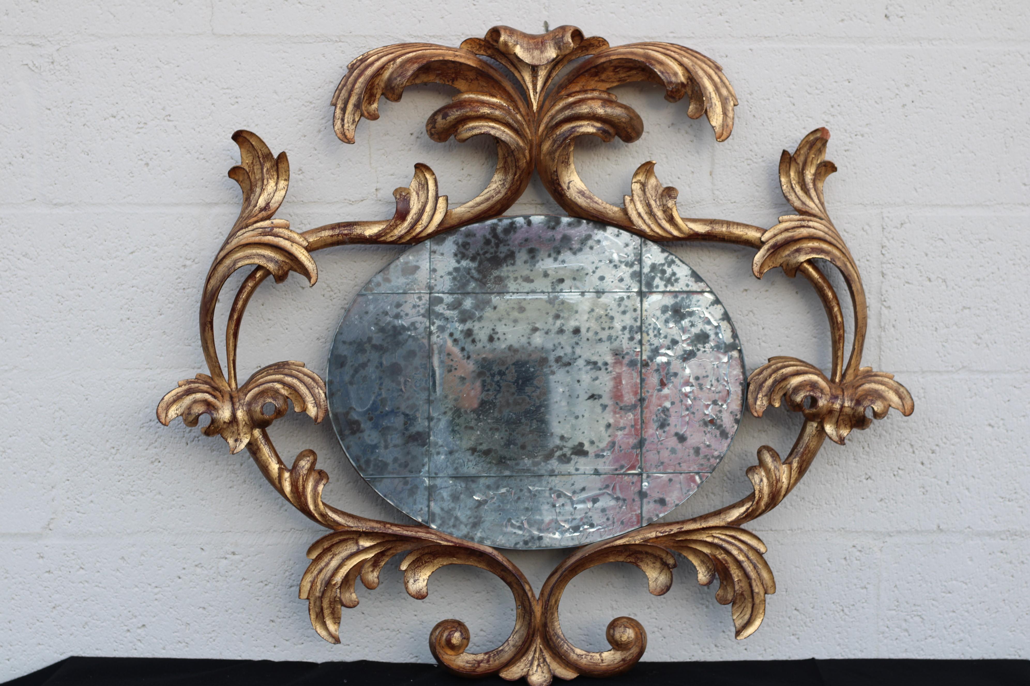 American Harrison & Gil Carved Giltwood Rococo Mirror with Antiqued Distressed Glass For Sale