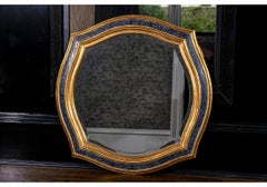 Harrison & Gil Dauphine Spiegel mit geschnitztem, ebonisiertem und vergoldetem Holzrahmen