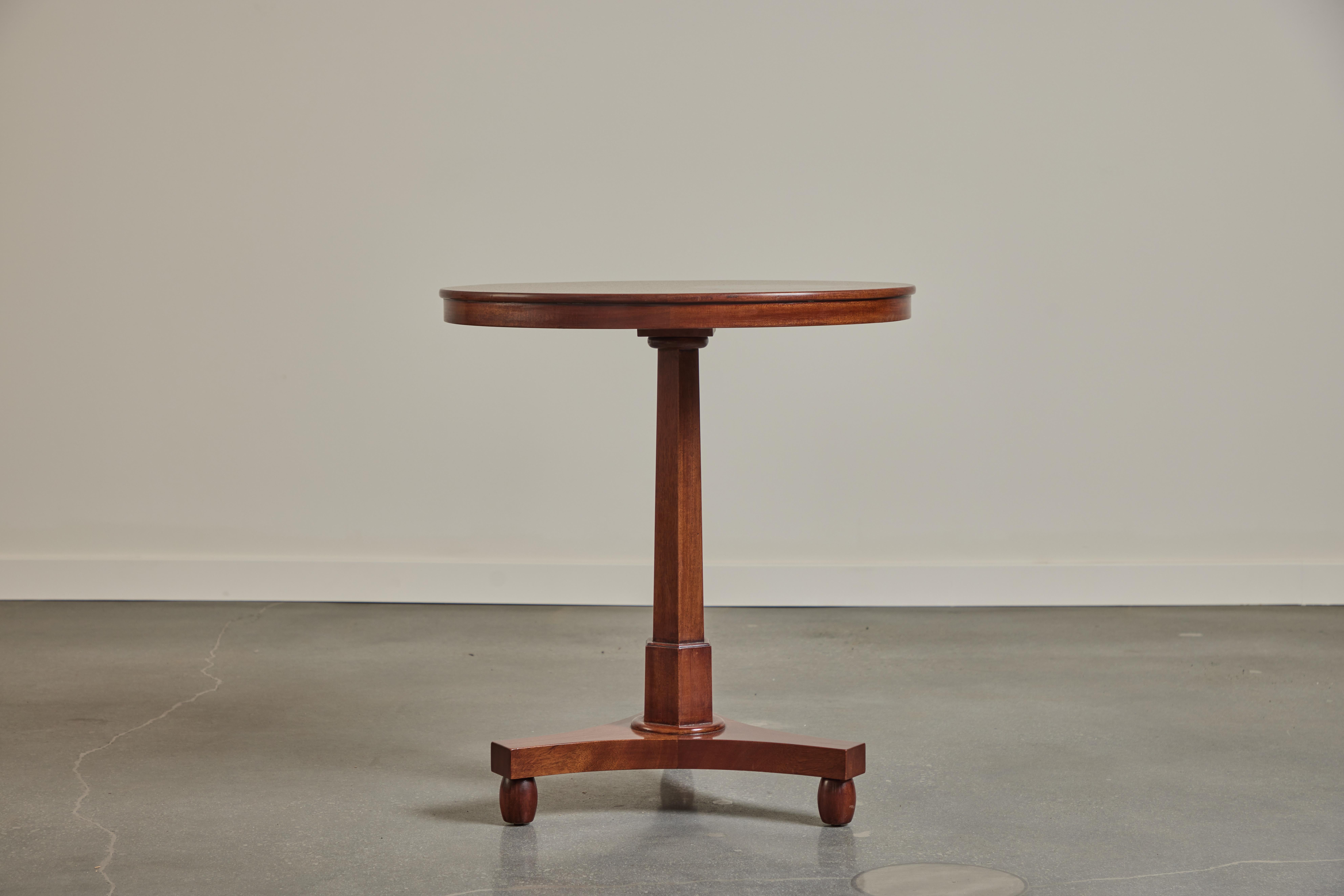 We make this Empire style side table to order from African Mahogany in our Los Angeles workshops.  We offer a durable lacquer finish or a traditional french polish. We can distress to give a more relaxed feeling or match color and finish to your