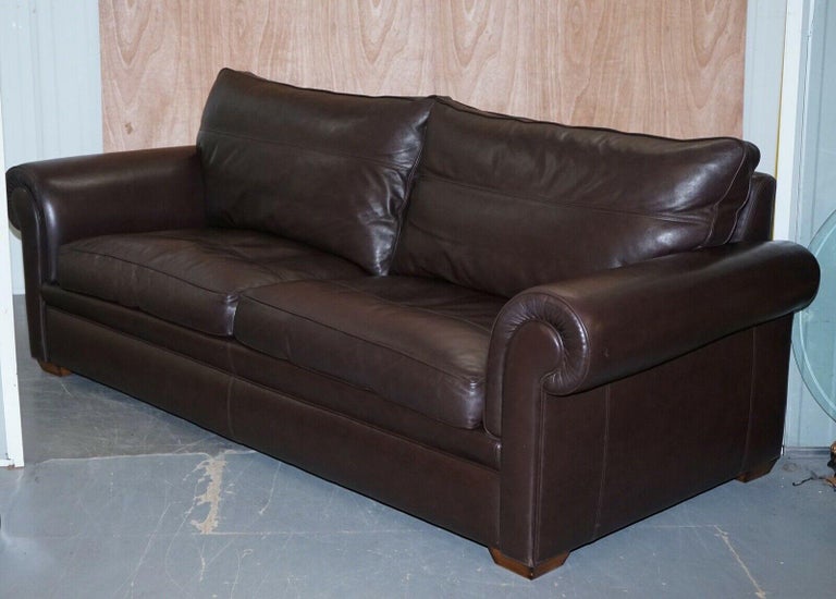 We are delighted to offer for sale this stunning Divine Duresta Garrick 3 seater dark brown leather sofa.

Giving you absolute comfort with feather filled back cushions and two scatter cushion feather filled too. The leather is in a mint