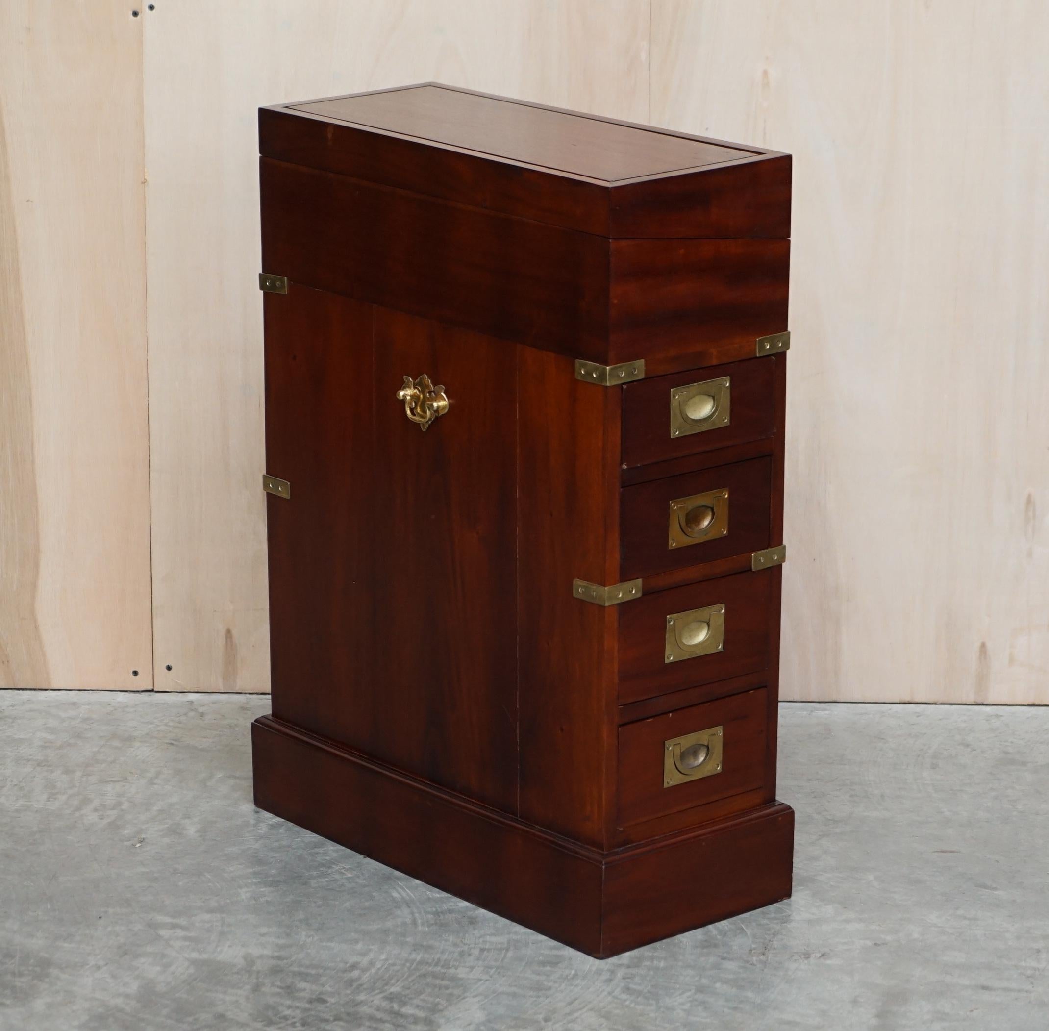 We are delighted to offer for sale this lovely vintage Kennedy Furniture made, retailed through Harrods London, Military campaign Davenport folding desk

A good looking and well made piece, it sits as a nice pedestal table with drawers both sides,