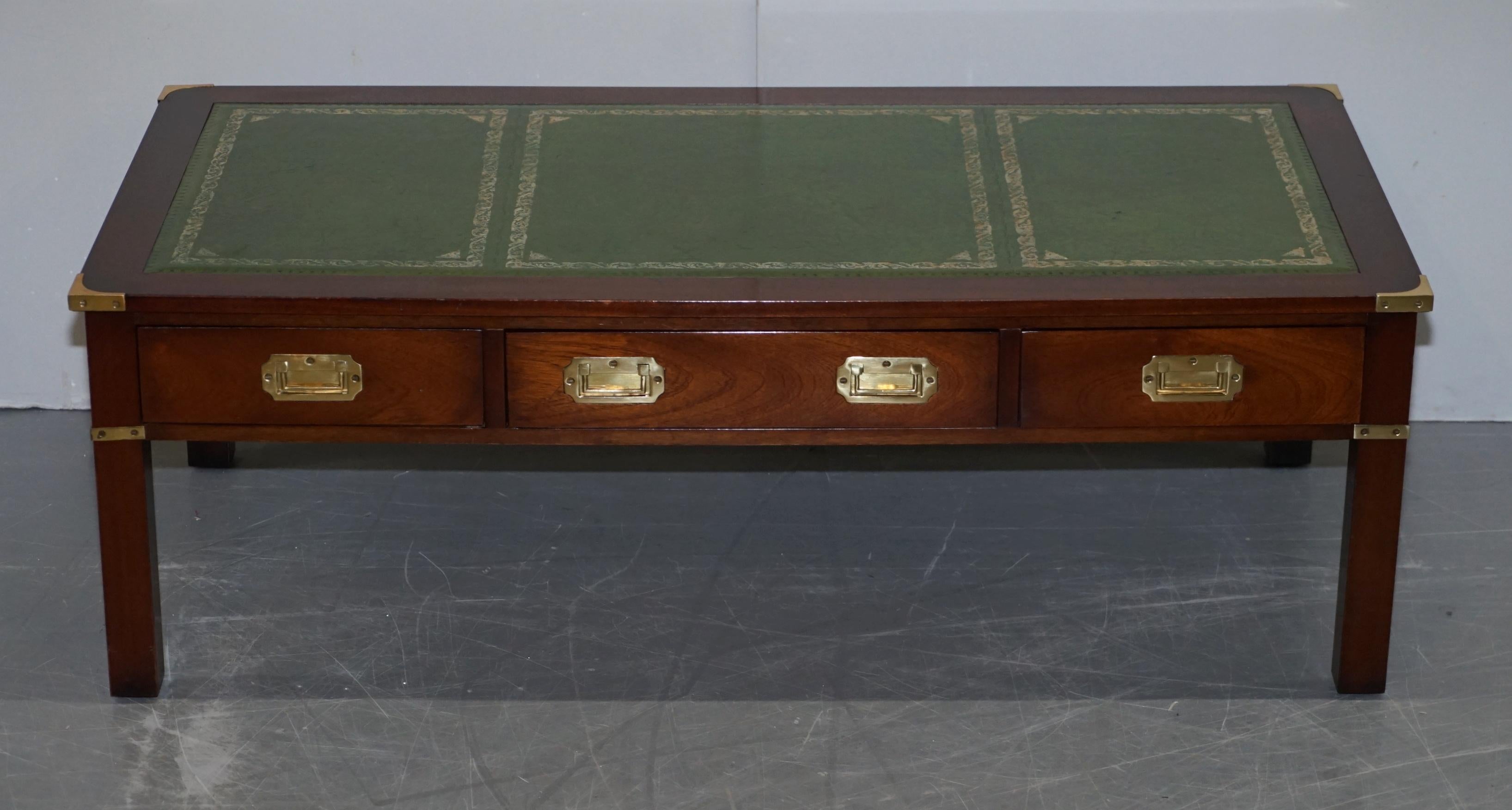 We are delighted to this vintage collectable Harrods London Military Campaign three drawer coffee table made by Kennedy with green leather top

This piece was sold through Harrods circa 20-30 years ago, it was made by Kennedy who were Harrods