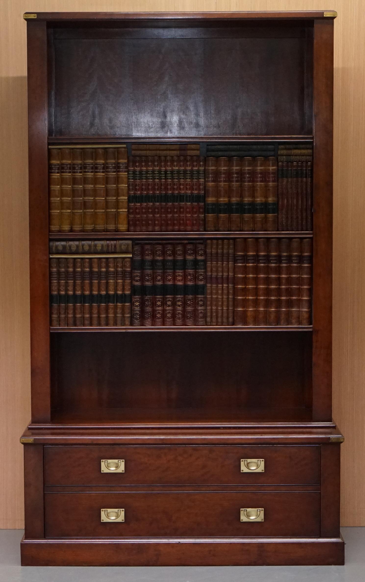 We are delighted to offer for sale this stunning custom made to order REH Kennedy furniture retailed through Harrods London bookcase TV cabinet with sliding faux books bookcase

This bookcase is amazing, the faux books split in the middle and