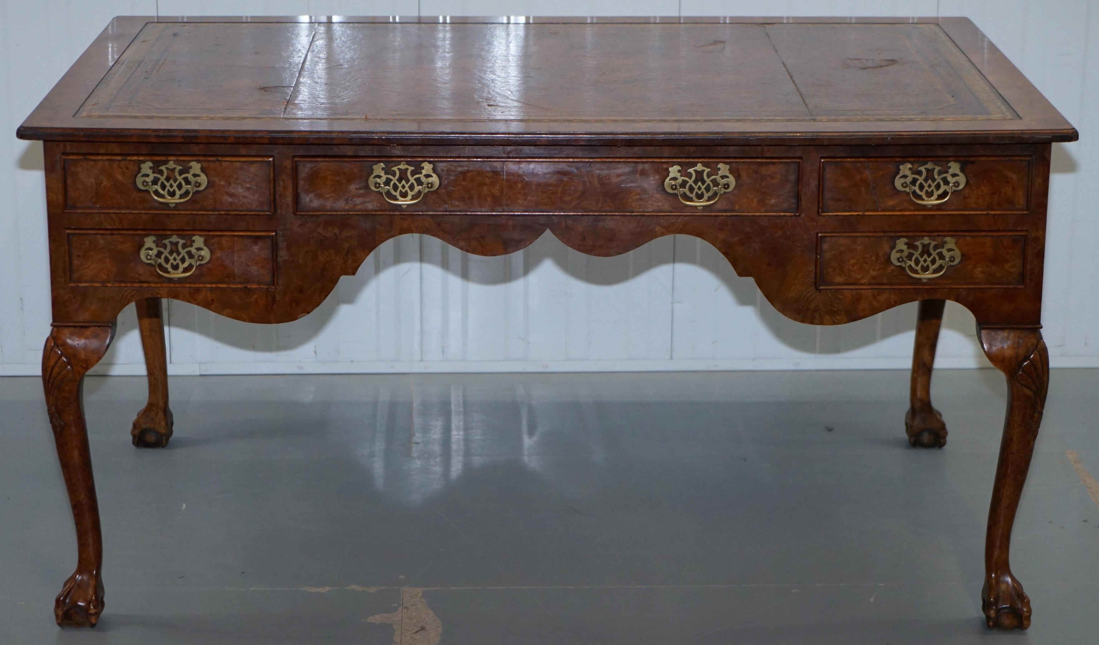 We are delighted to offer for sale this stunning Harrods London burr walnut writing desk with brown leather surface and long cabriolet legs finished with claw and ball feet

T’s a fine example of a library reading table and partner desk. The burr