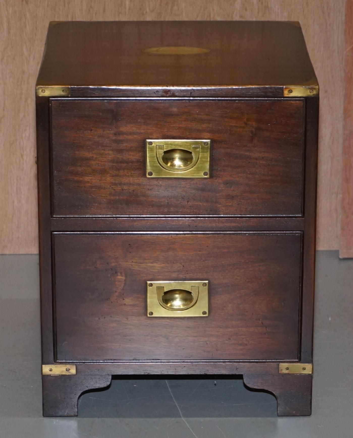 We are delighted to offer for sale this lovely Harrods London Kennedy solid mahogany Military Campaign bedside table sized chest of drawers

An excellent piece, designed as a lamp or wine table but can of course be used in the bedroom as