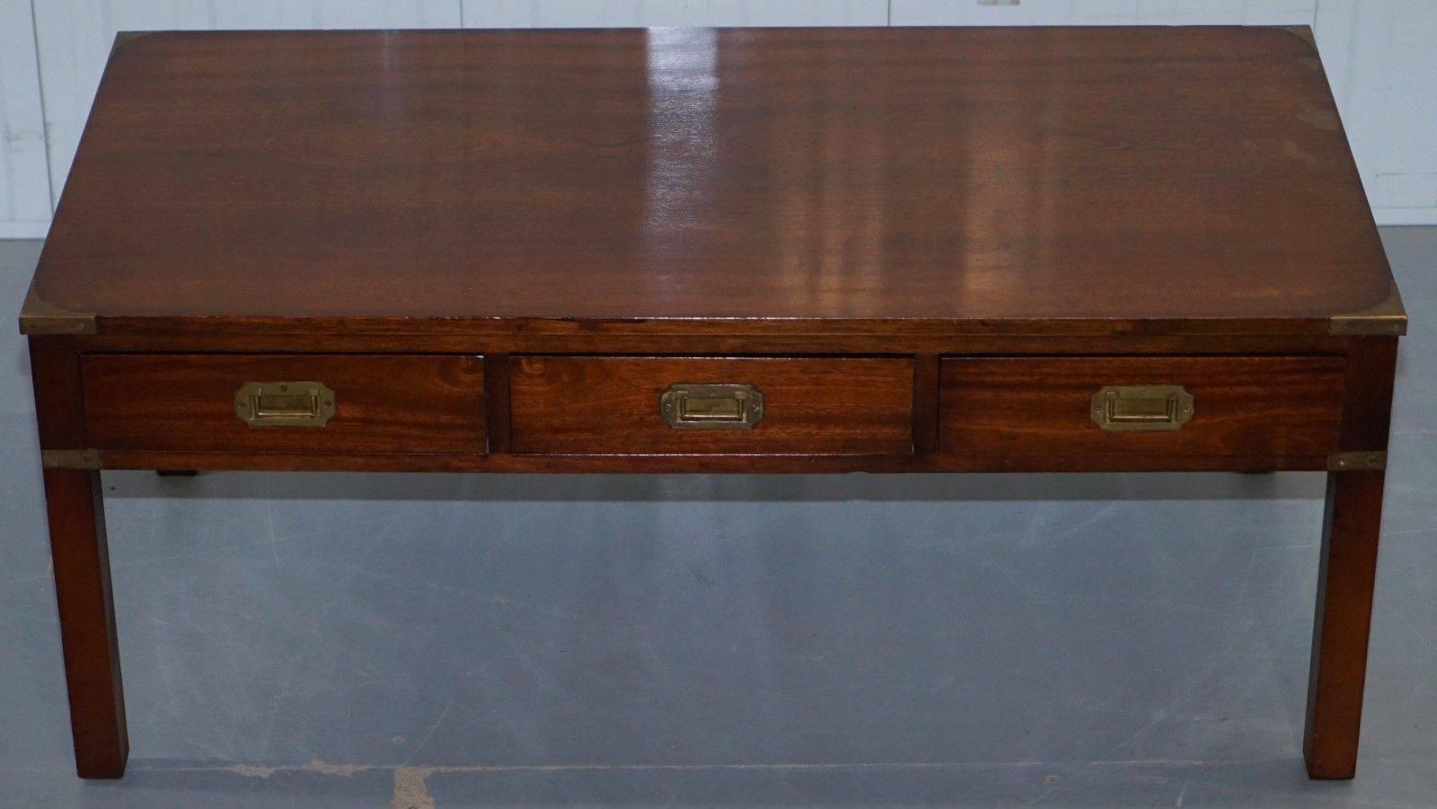We are delighted to offer for sale this stunning Harrods London large mahogany military campaign coffee table brass handles

This table is in good vintage condition, it was purchased from Harrods London around 15 years ago, the top has normal