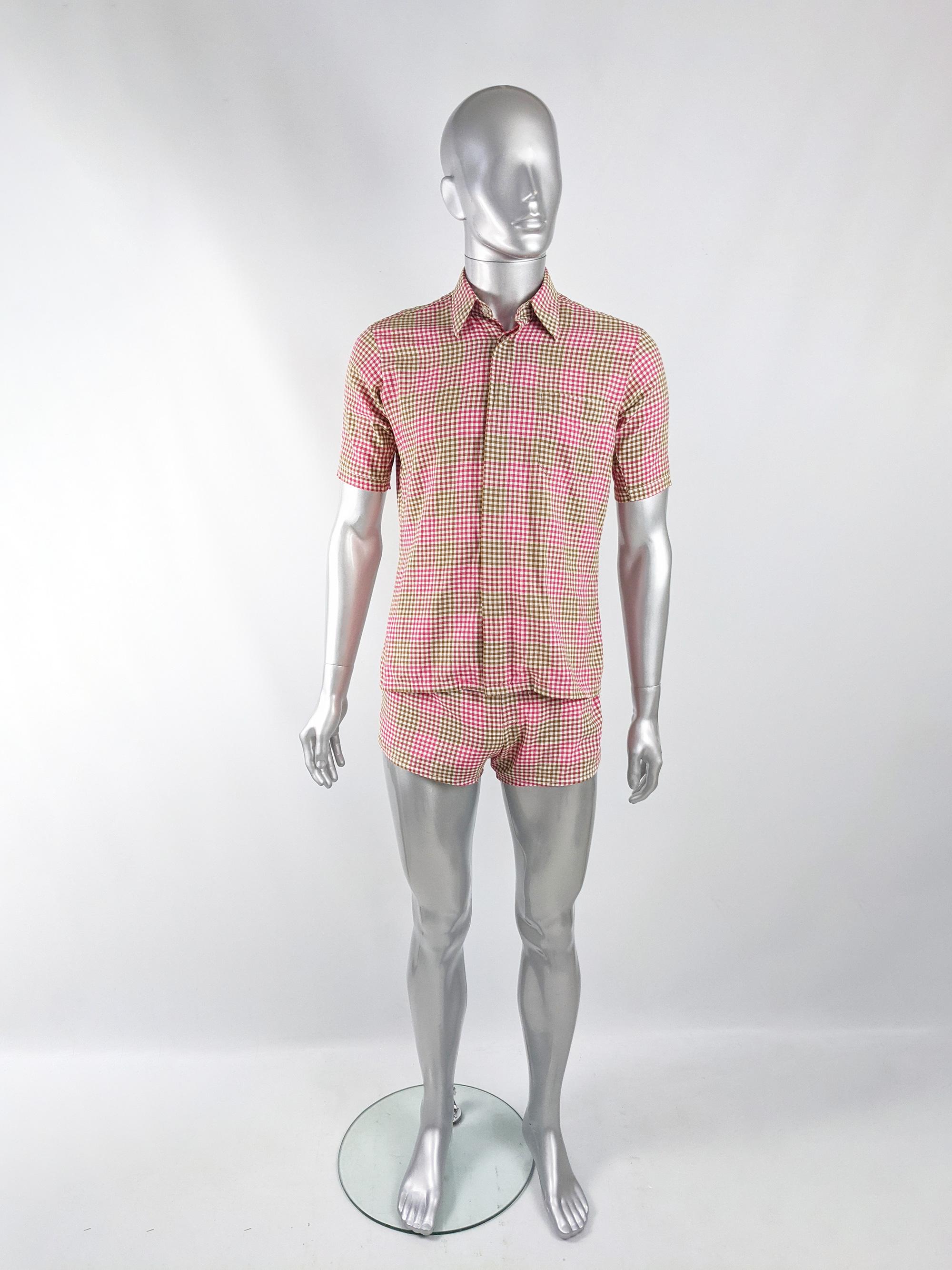 An incredible and rare vintage mens 2 piece swim suit from the 60s by luxury British department store, Harrods. In a white, pink and green gingham check cotton, it consists of a matching shirt and mesh lined swim shorts. Perfect for collectors or