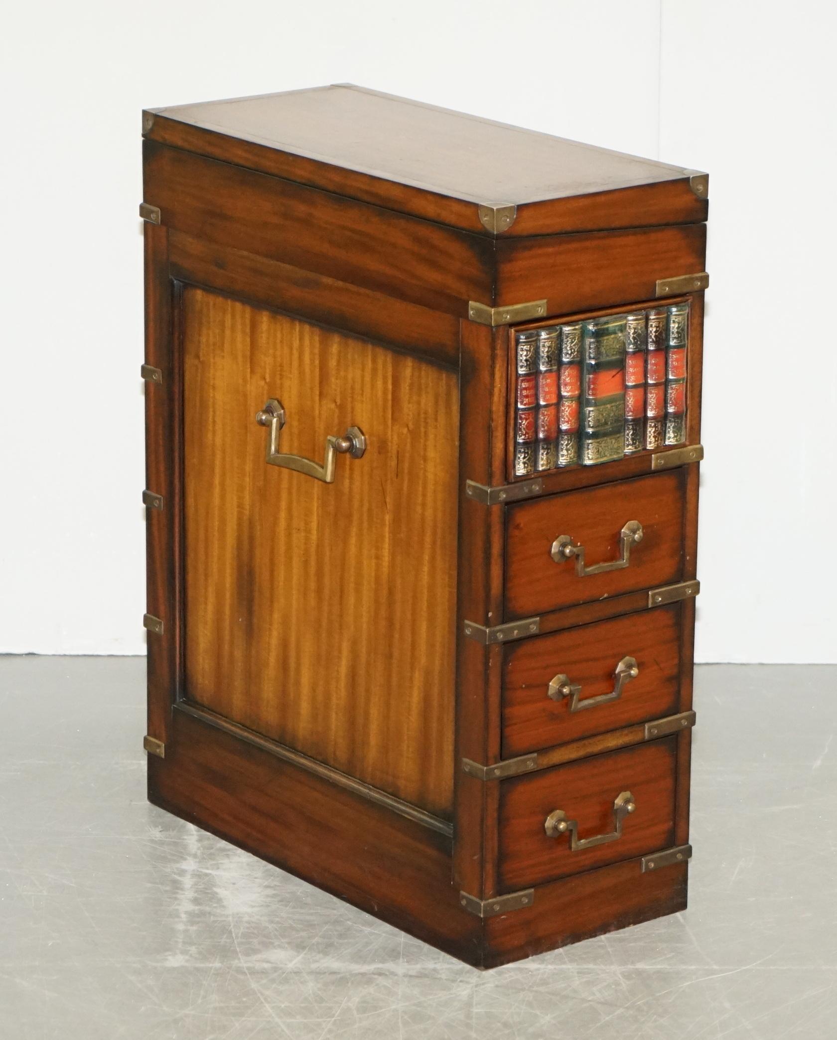 We are delighted to offer for sale this lovely handmade in England Harrods London Military Campaign chest of drawers with brown leather writing slope and faux book drawer, ideal for a laptop table 

A very good looking well made and decorative