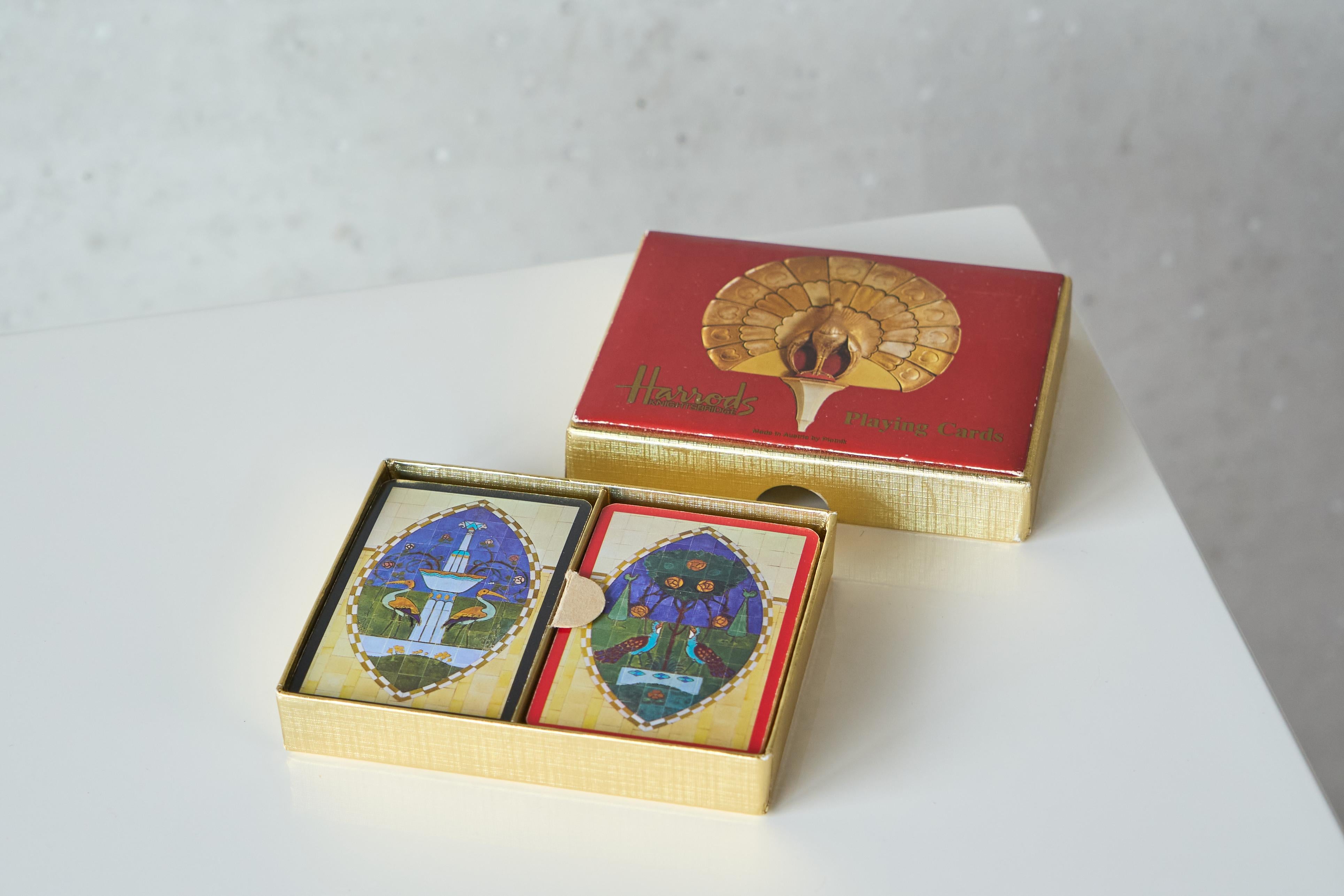 Harrods of London Mid Century Deck of Playing Cards.

Very stylish and decorative deck of mid century playing cards by Harrods of London - made by high end manufacturer Piatnik from Austria. 

Wonderful box in gold and red - inside the playing cards