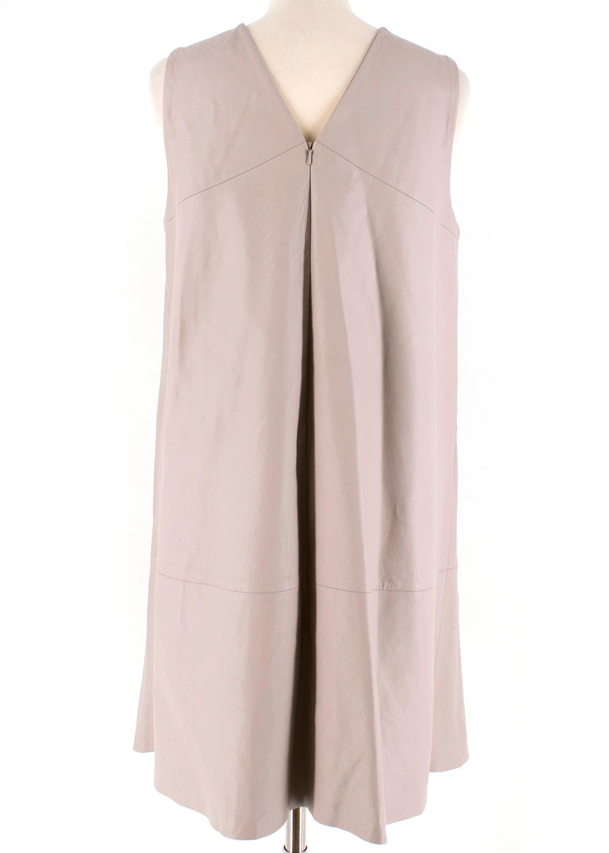Harrods Taupe Leather Sleeveless Shift Dress featuring a sleeveless design, round neck, concealed zip fastening at back and a short length.

- Lightweight 
- Non-stretchy fabric
- Slightly loose fit 

Composition:
- 100% leather

Care:
- Specialists