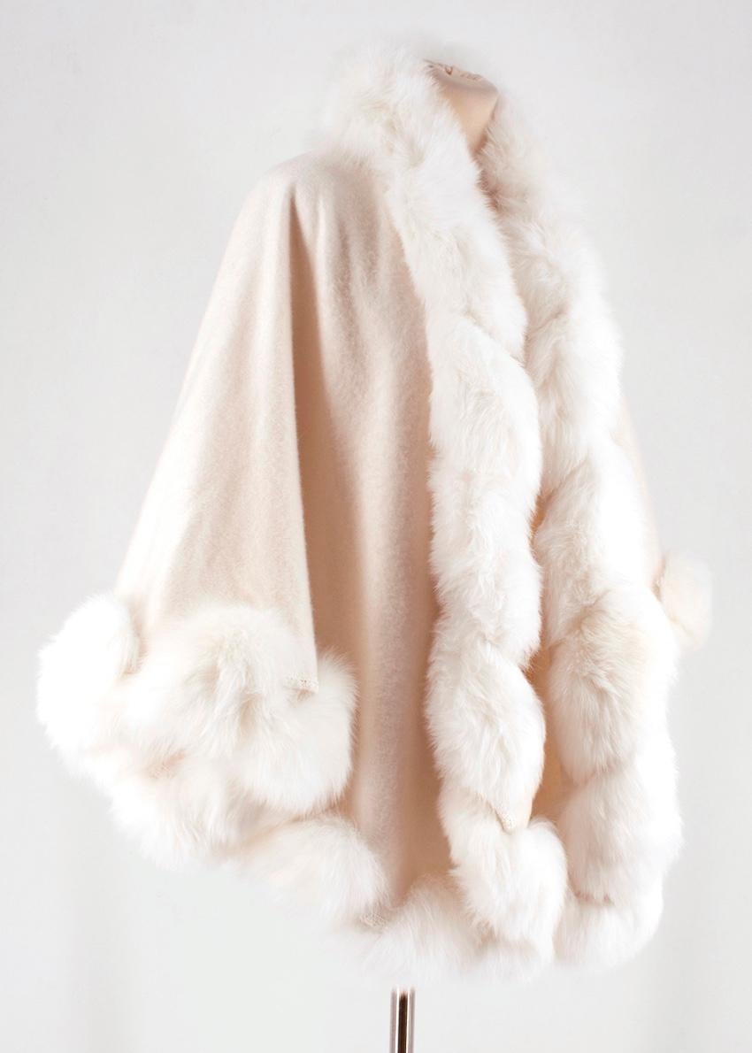 Harrods - white cashmere fox fur trim cape

- relaxed fit
- hook fastening at the neck 
- snap button fastenings at the side 
- fox fur trim detail

- 100% cashmere, trim 100% fox fur 
- specialist fur clean

Please note, these items are pre-owned