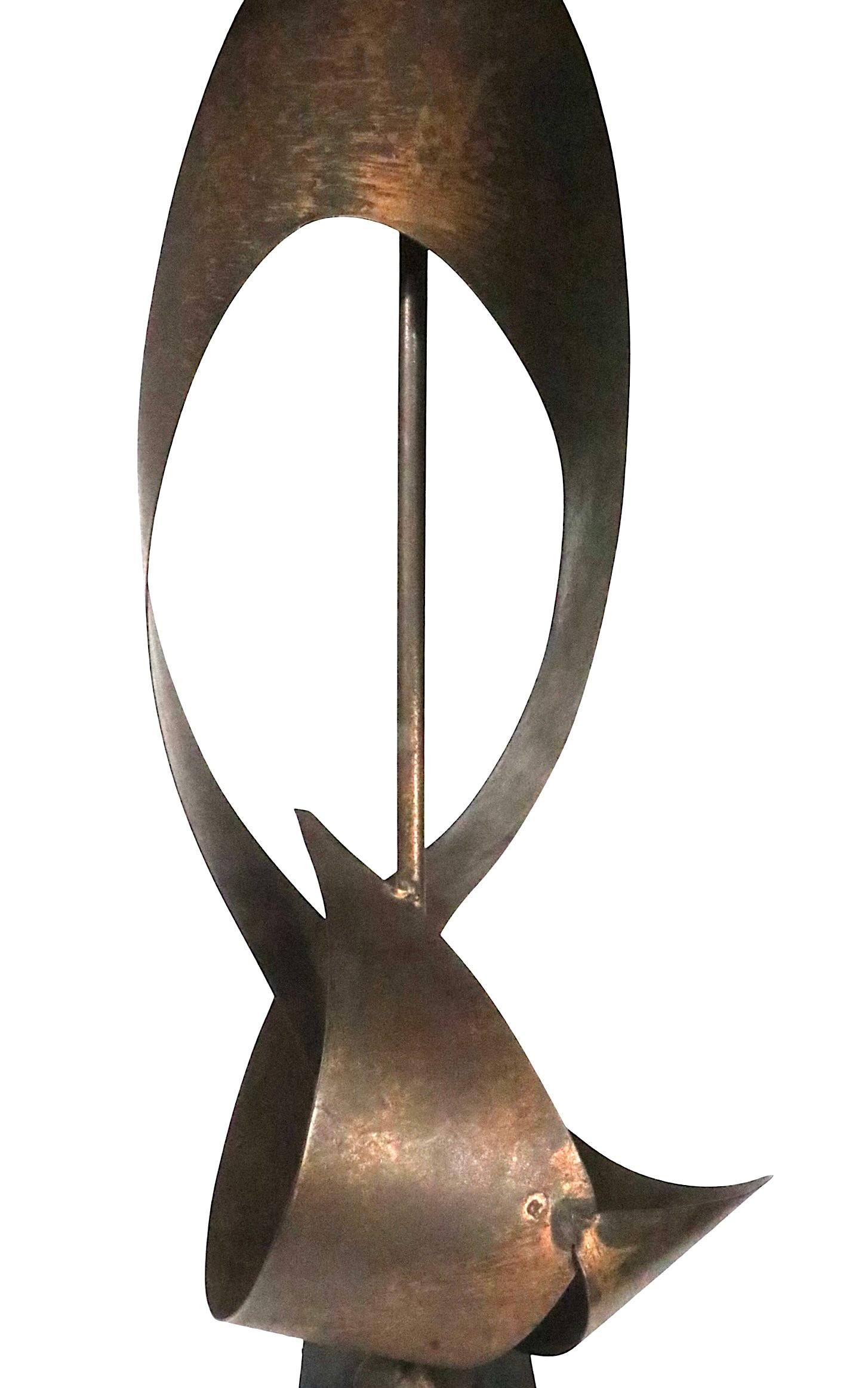 Classic Brutalist school table lamp designed by Harry Balmer and Harold Weiss, for the Laurel Lamp Co. circa 1960/70's.  Known as the Ribbon Lamp, this piece features an exaggerated sculptural metal body constructed of toned steel, mounted on a