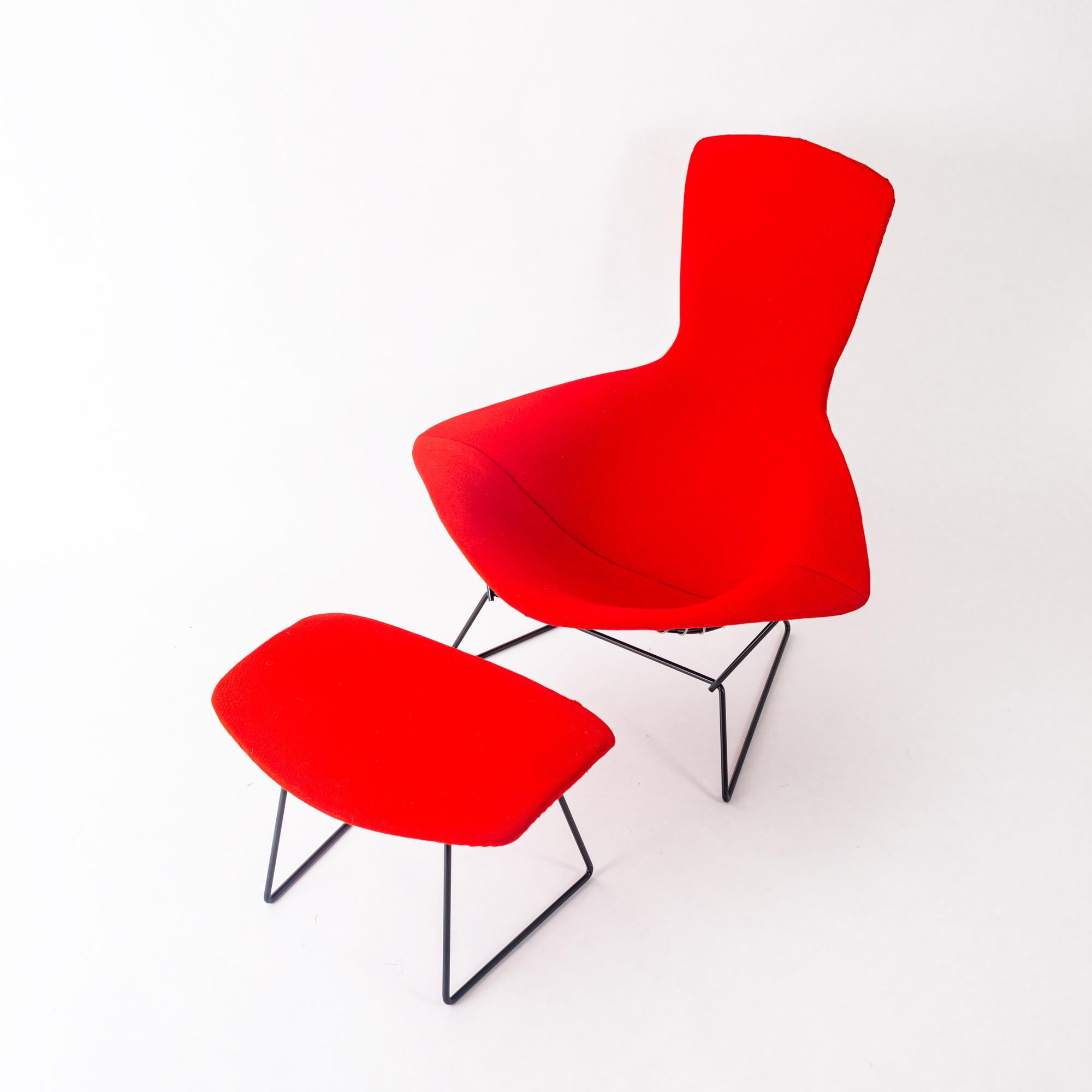 Original & authentic Harry Bertoia Bird chair & ottoman for Knoll, circa 1960s. Original fabric flame red slip cover on metal frame that recently went through full metal work and freshly powder coated in classic black. Chair cover still retains