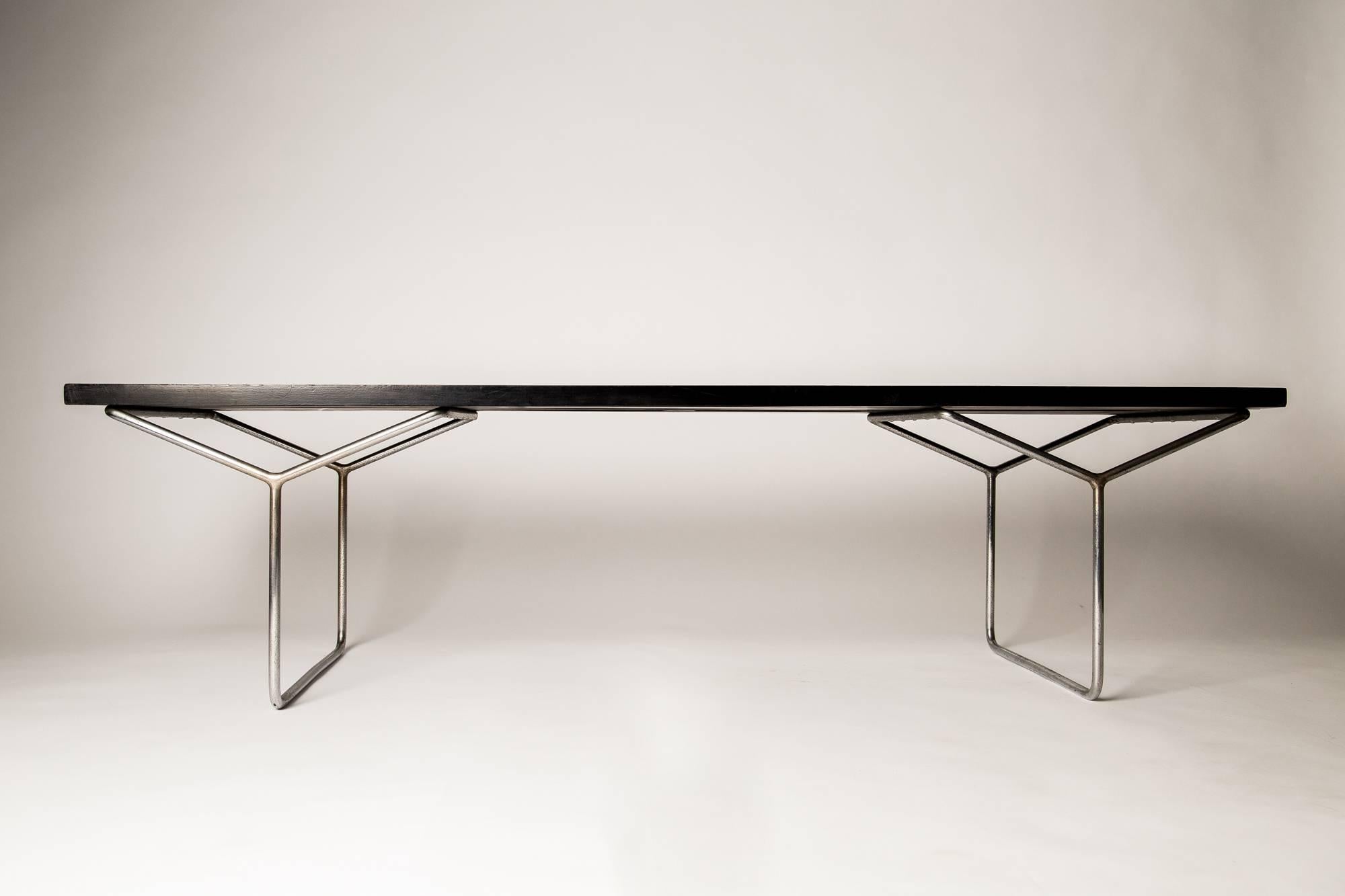 With tubular metal frame and lacquered wood top. Original metal plate label - Pizzetti, Industria Della Poltrona, Roma

Architectural in design, ideal as either coffee table or bench.