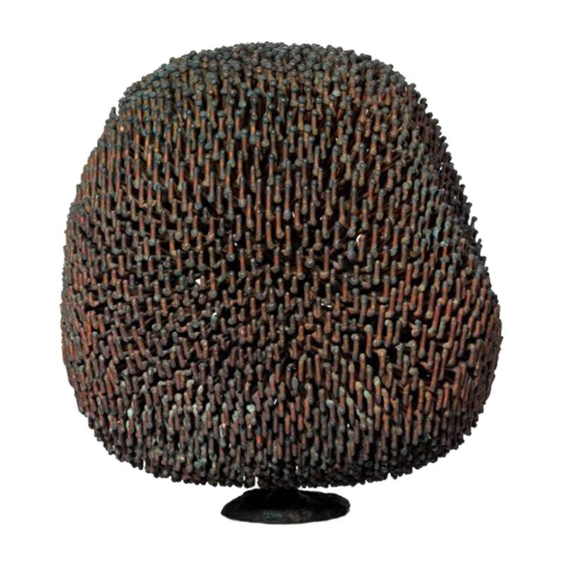 The bush sculptures Harry Bertoia created vary in size density and complexity and this sculpture is an example of one of the more complex and interesting forms. The sculpture has two central buds recessed behind the branches. The density of the
