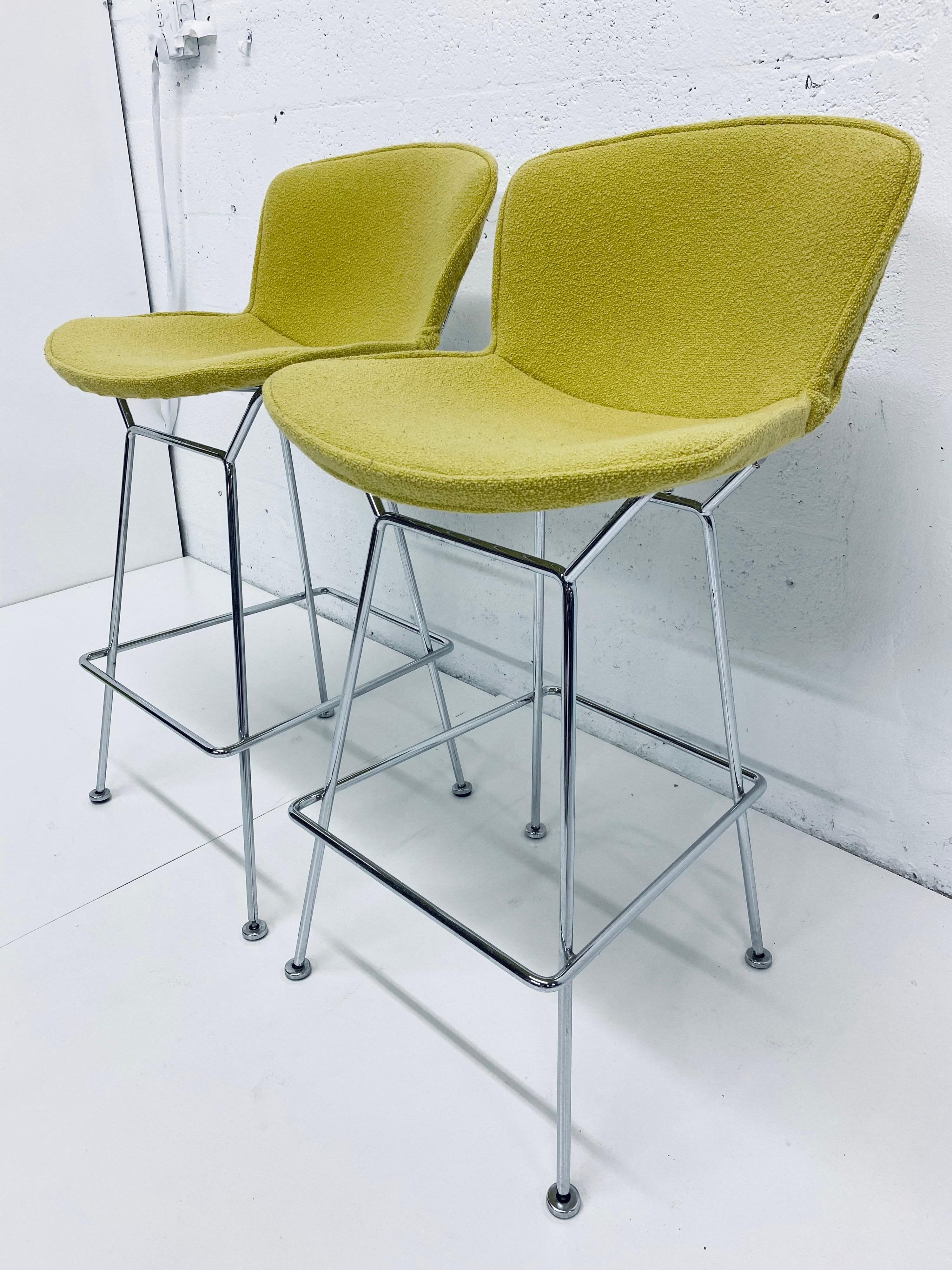 Iconic set of two bar stools by Harry Bertoia for Knoll International. Chrome frames with original citron yellow covers. United States, 1970s. Stamped Knoll on frame.