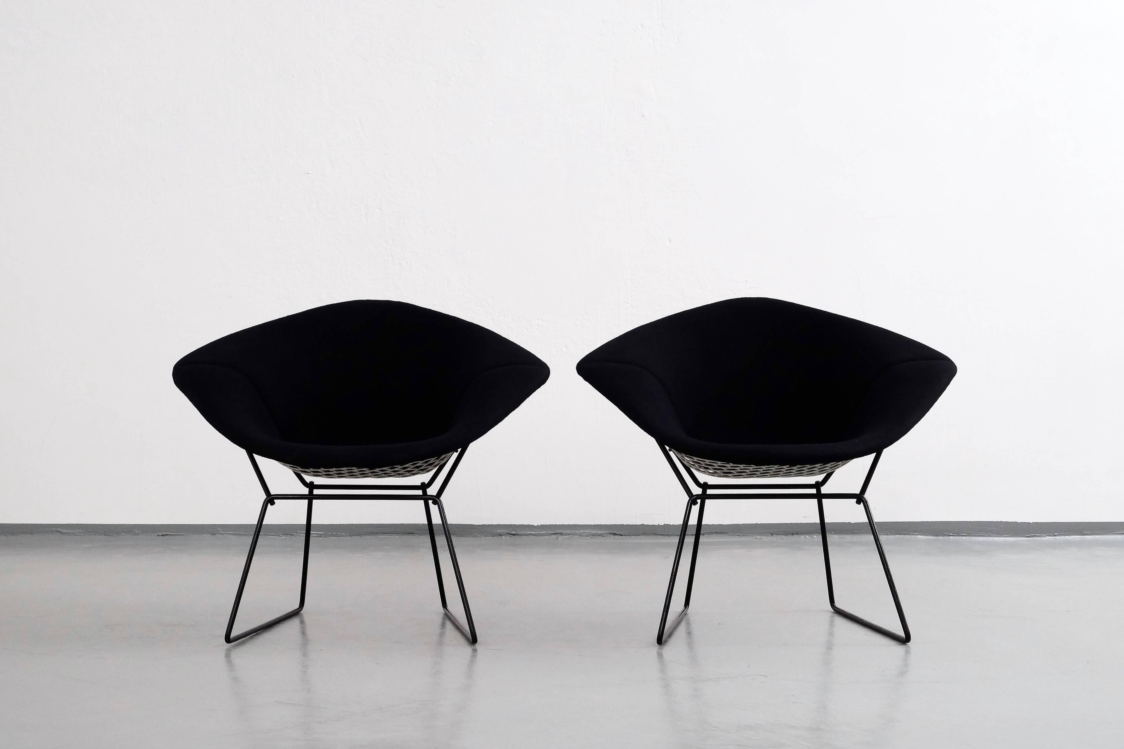 Harry Bertoia 'Diamond' armchairs retaining their original covering and enamel paint surfaces, remain in outstanding condition. The original black woven coverings are in very clean condition.

1 chair in stock
