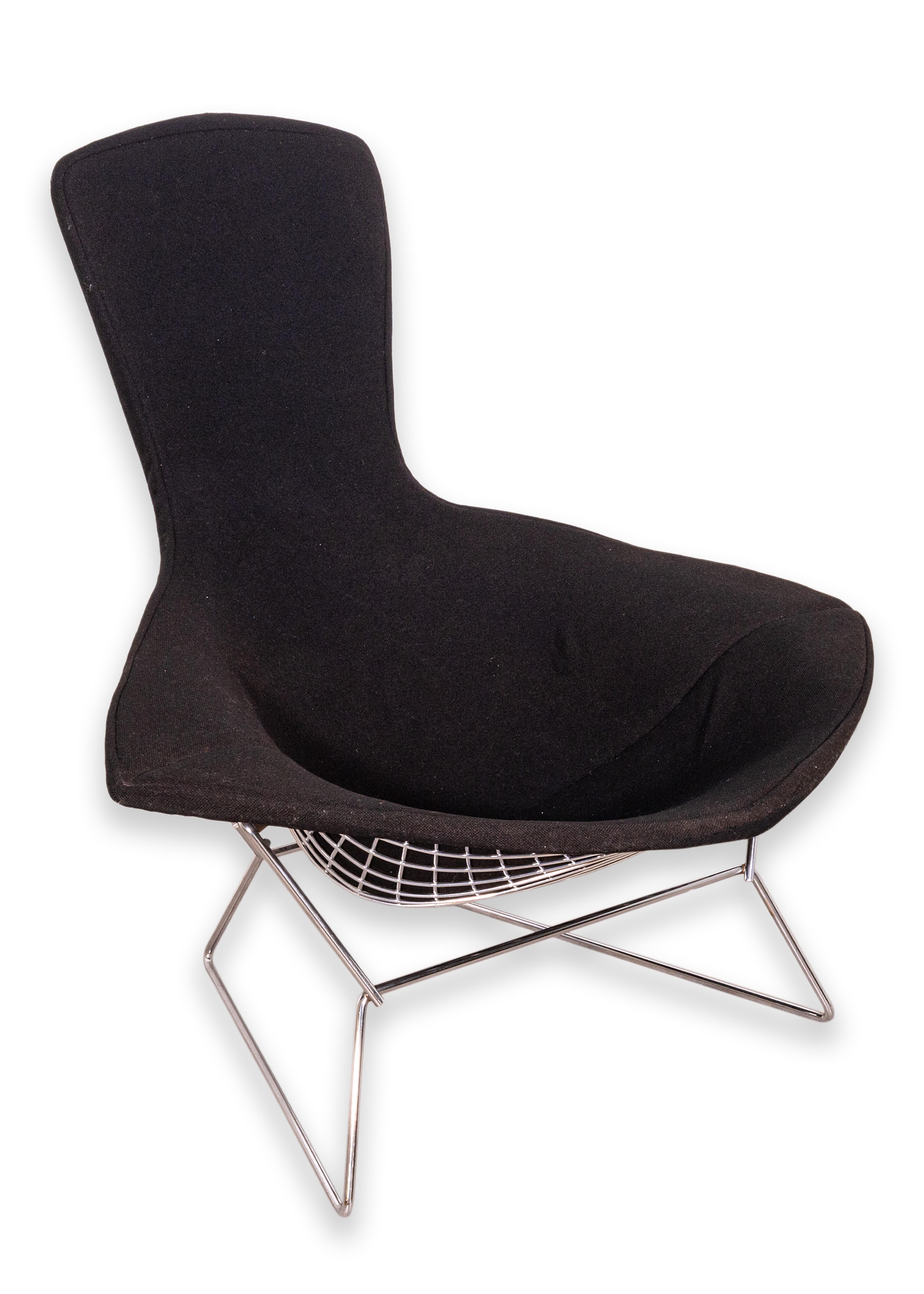 An iconic “Bird Chair” with the matching ottoman by Harry Bertoia for Knoll. Original black upholstery. Early edition, circa 1960s. The high back design is a modern statement but also practical by providing additional comfort when lounging. Per