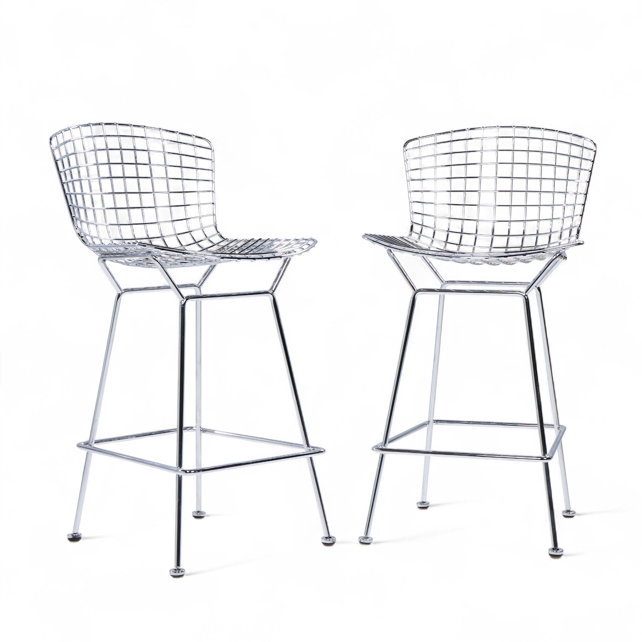 Harry Bertoia for Knoll Mid Century Chrome Counter Stools - Pair

Each stool measures: 21 wide x 23 deep x 39.5 high, with a seat height/chair clearance 27.5 inches

Excellent Condition.

We take our photos in a controlled lighting studio to show as