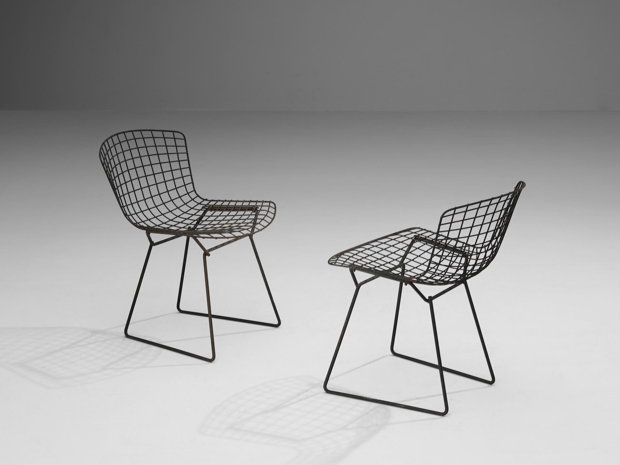 Harry Bertoia for Knoll International, pair of 'side chairs', coated steel, United States, design 1952

These 'side' patio chairs are designed by Harry Bertoia in 1952. Executed in black coated steel, these chairs feature an intricate interlacing of