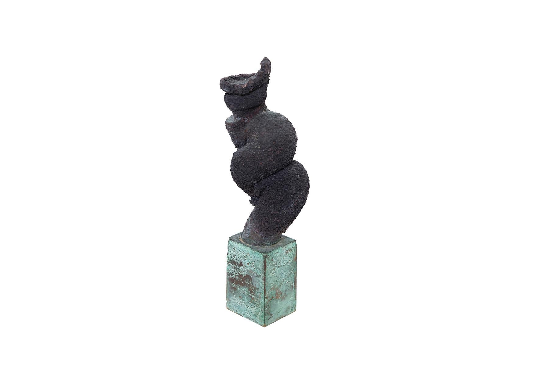 Whimsical sculpture with green-patina base and blackened twist form by Harry Bertoia. Please inquire about Red Modern's other small sculptures available by Bertoia.