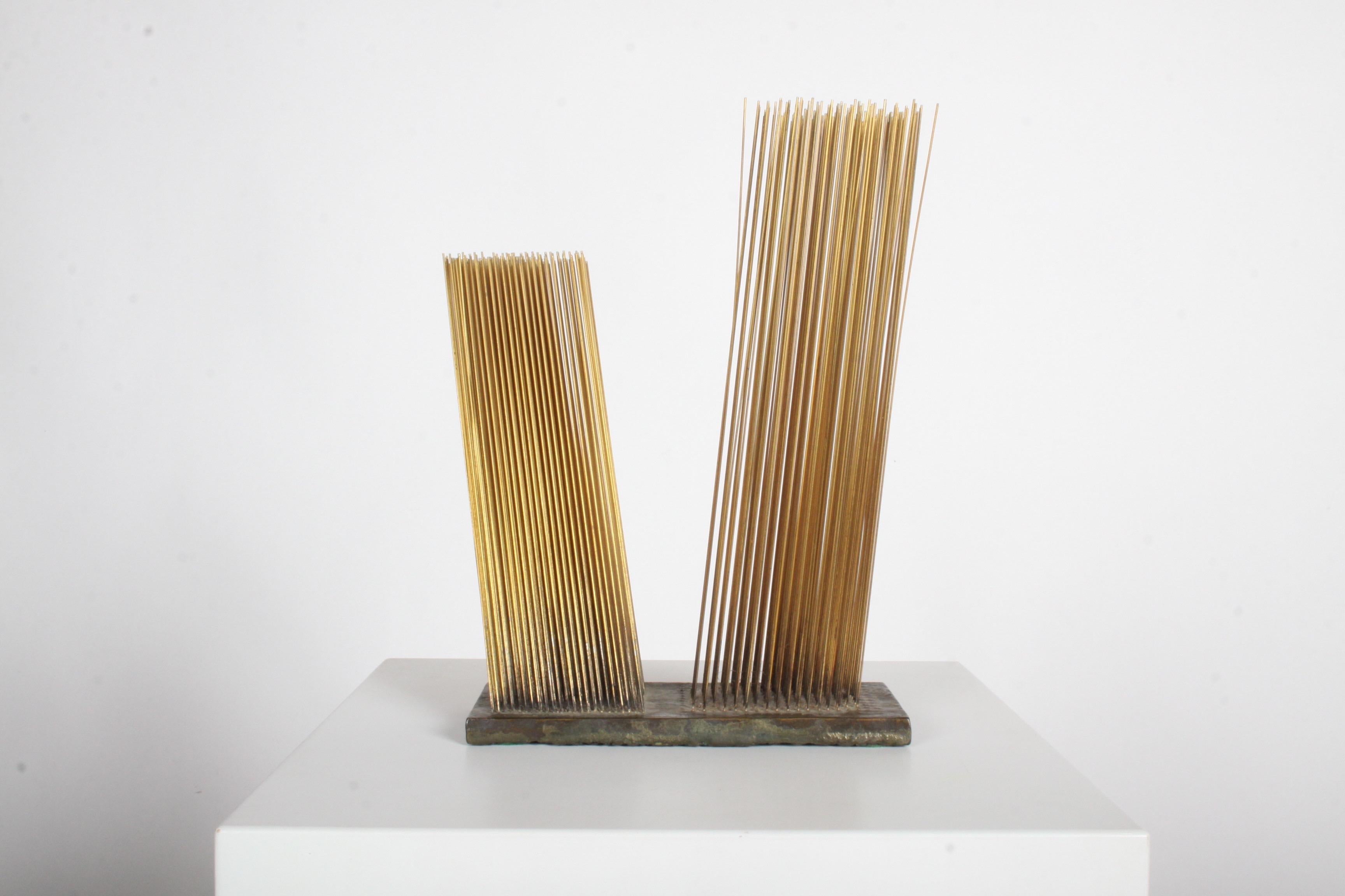 Harry Bertoia gold plated bronze Sonambient sculpture, diagonal double tonal, circa 1965.
Two groupings of thin rods at different angles on poured slab of bronze. Purchased from estate of the original owner. Sold with a “Certificate of