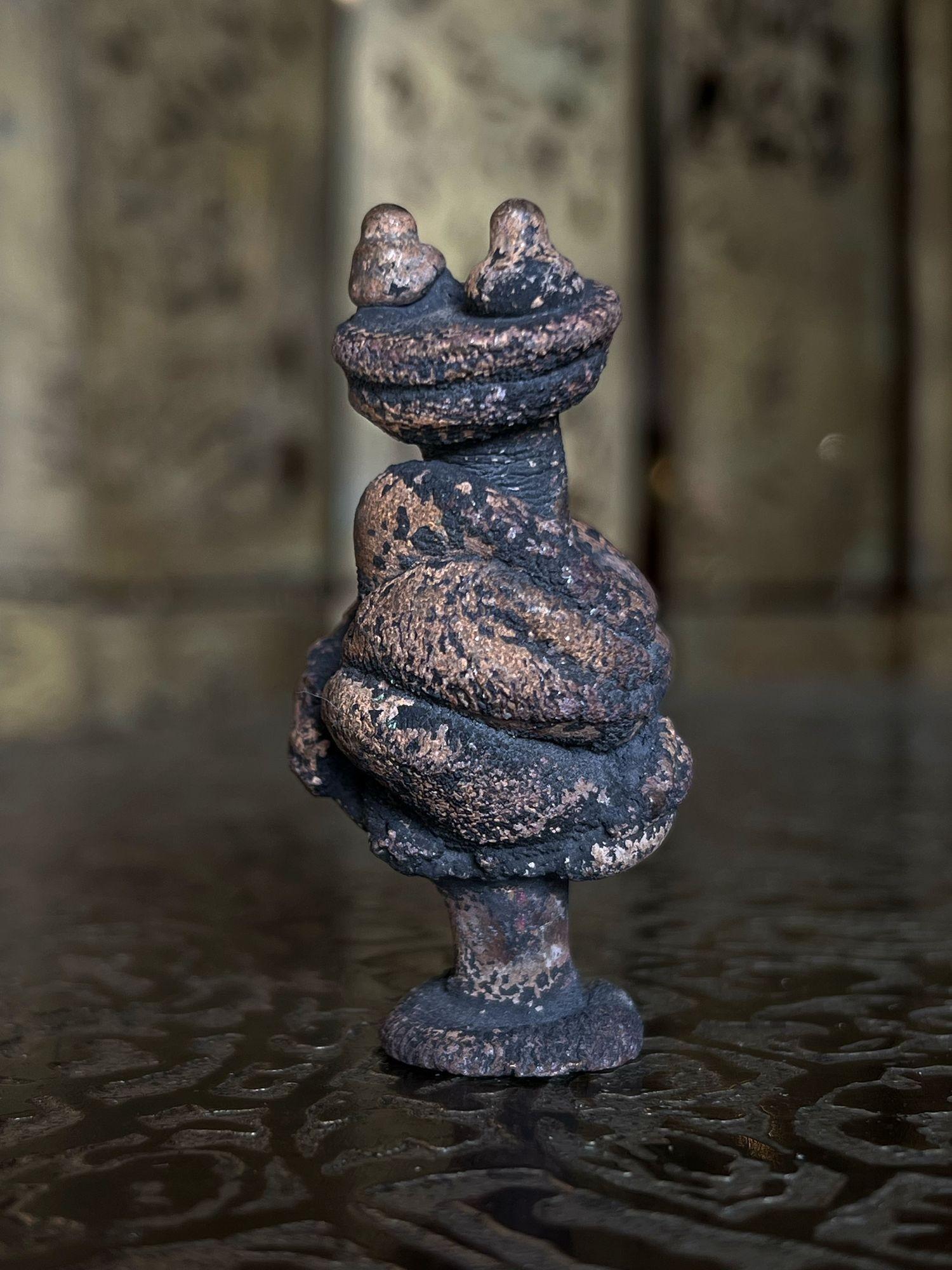 A figurative vertical form with two protrusions on top constructed of melt pressed bronze (heated numerous times, squeezed, and shaped. Includes provenance and hand-signed COA from the Bertoia Foundation.