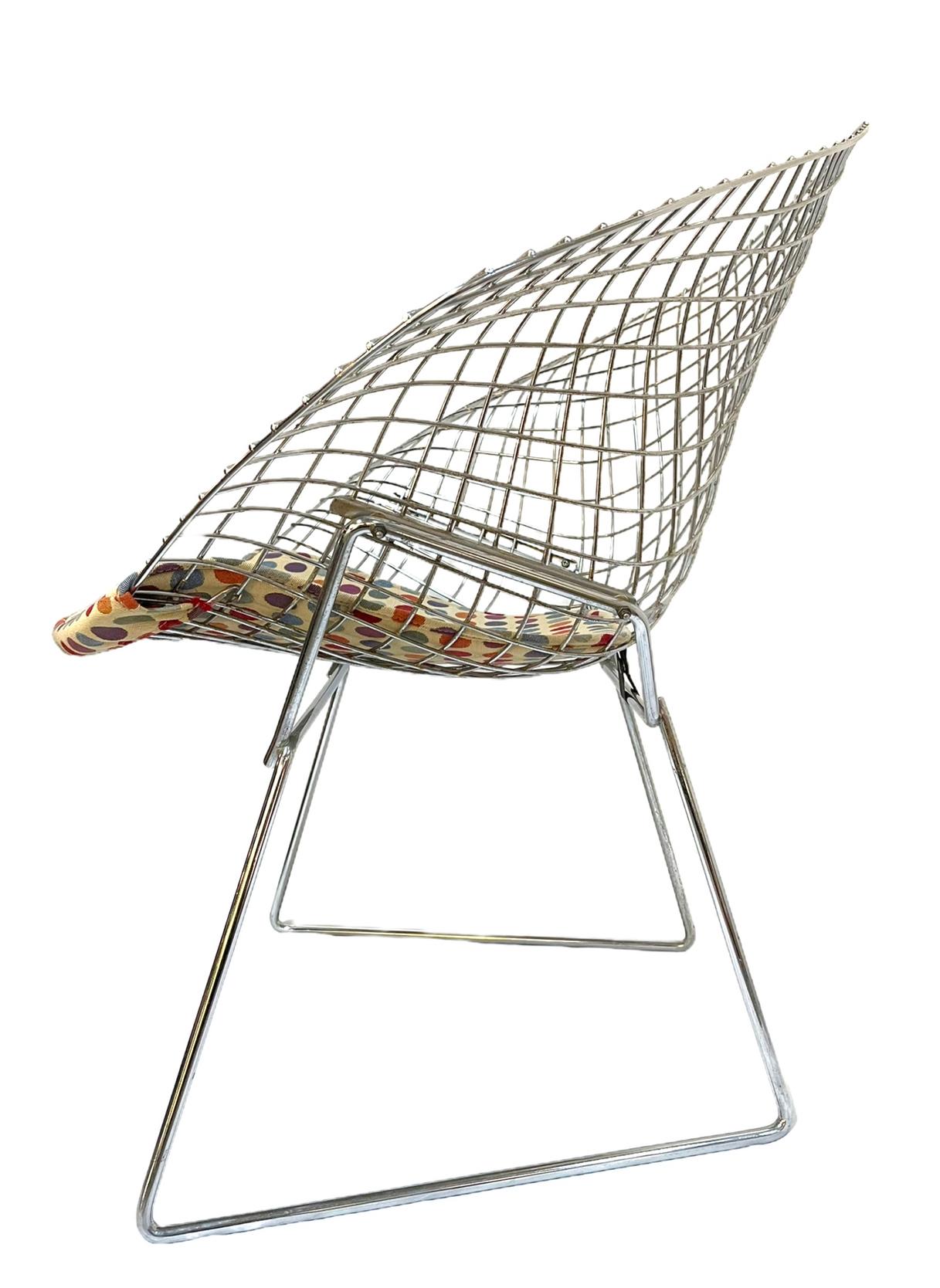 In the style of Harry Bertoia Diamond chair. Seat pad made from custom reupholstered vintage fabric. Thought to be an original from the period, but cannot find a maker marking. 

Sculptural form and a canted seat back make the Bertoia Diamond