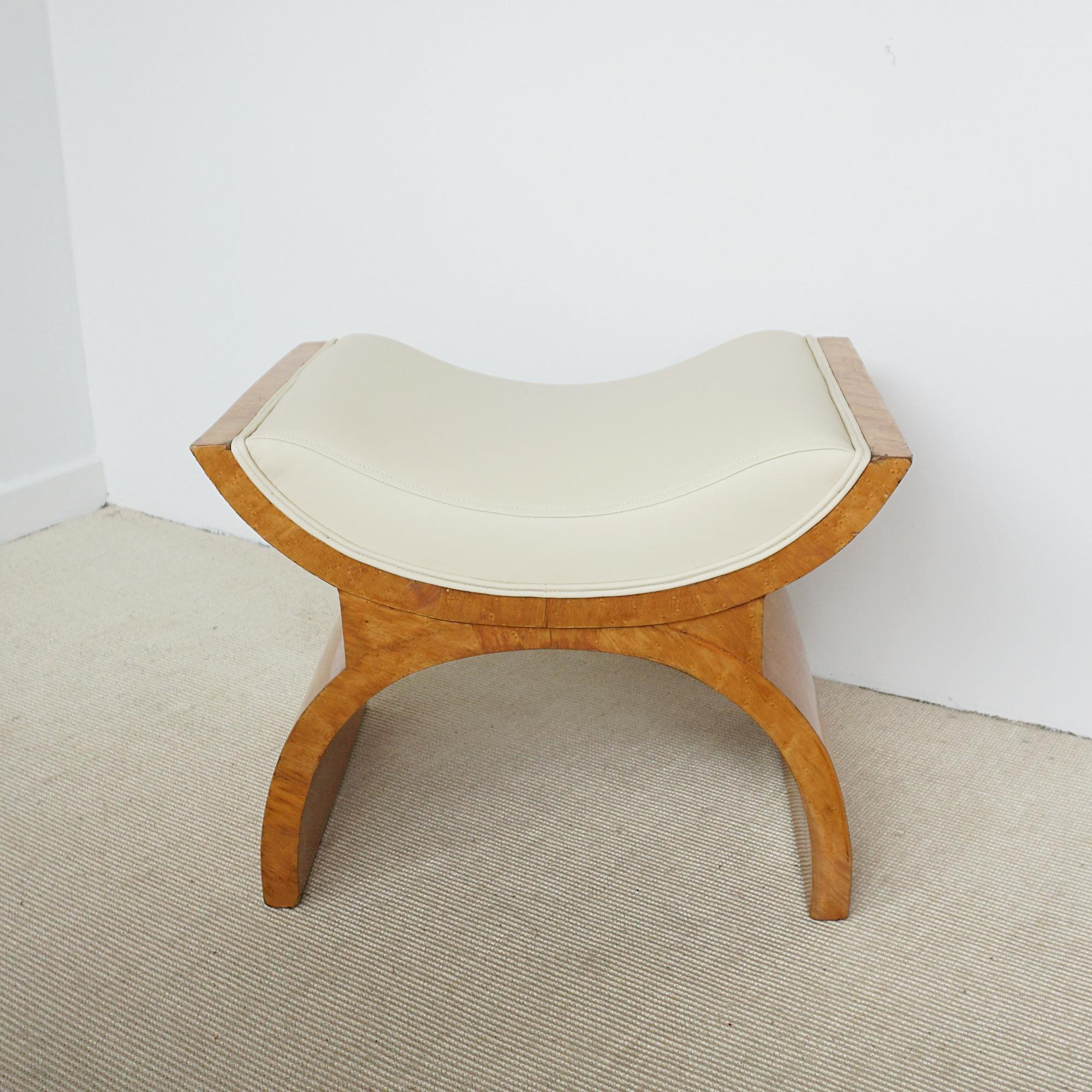An Art Deco X-Framed stool by Harry & Lou Epstein. Birdseye maple veneered with cream leather re-upholstery. 

Dimensions: H 45cm W 60cm D 45cm

Origin: English

Date: Circa 1935

Item Number: 3004243