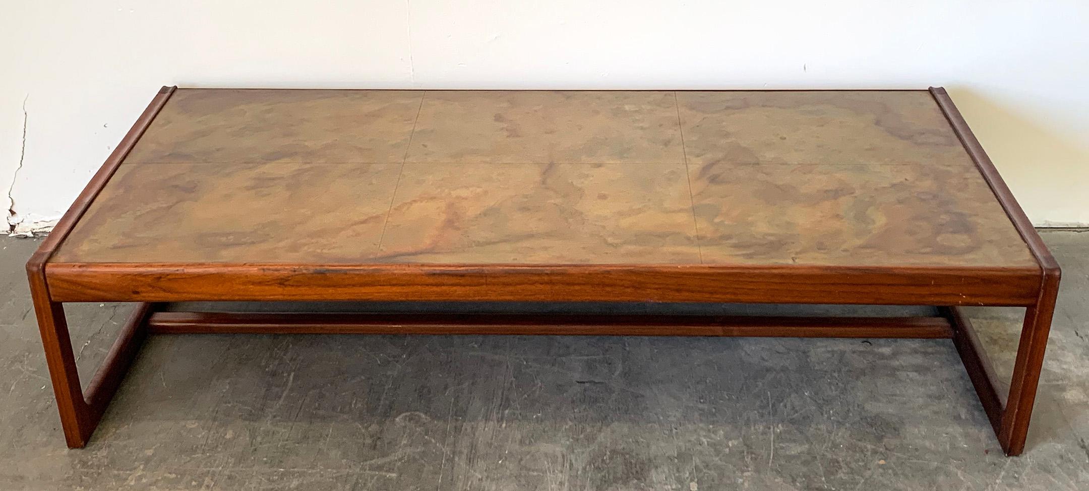 Available right now we have this stunning coffee table by Seattle artist and furniture designer Harry Lunstead. Lunstead has been known and renowned for his work with copper and using acid to stain and etch each piece, giving it a unique look that