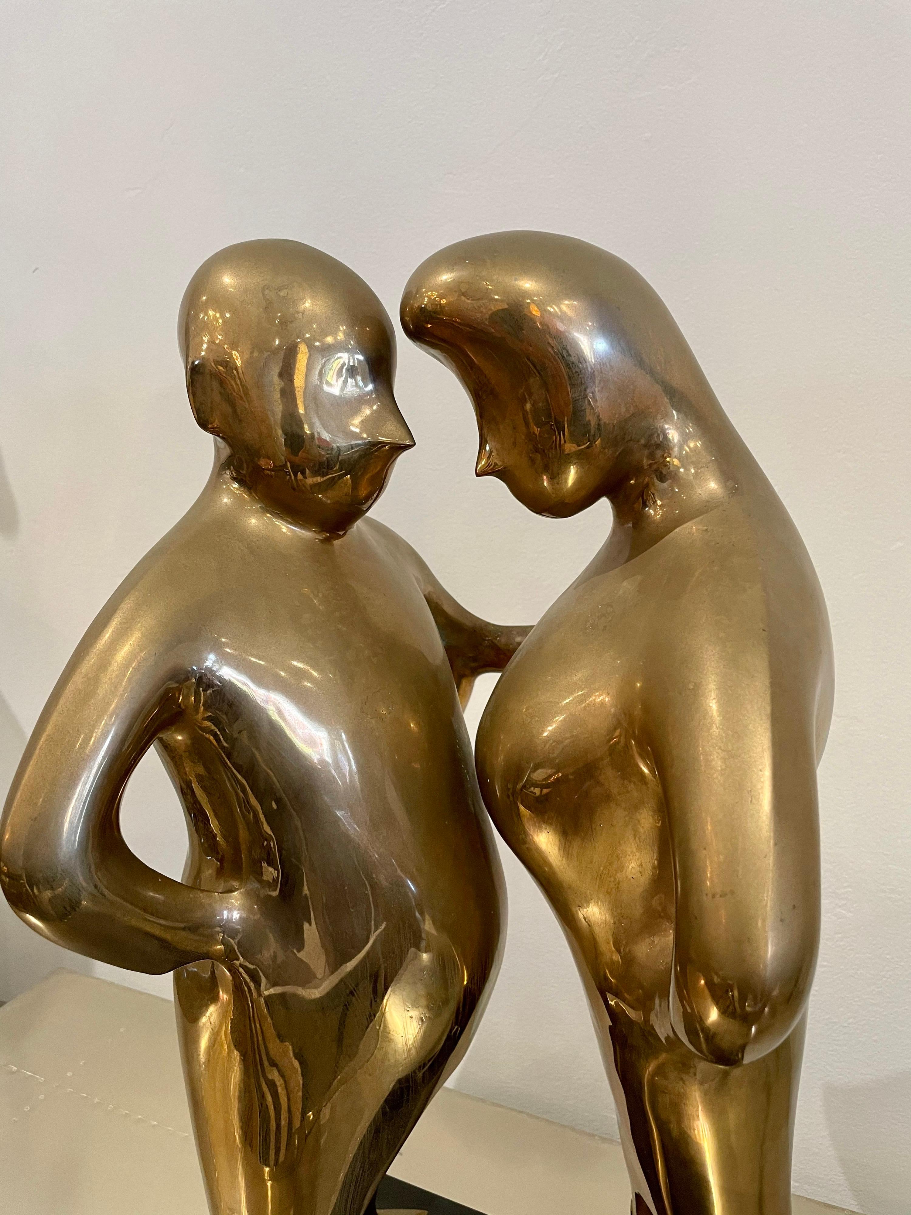 Harry Marinsky, U.K./American (1909-2008). Bronze sculpture of 2 figures facing each other with small dog at their feet, mounted on black base. Signed and numbered 1M10. Base dimensions only: 10.25
