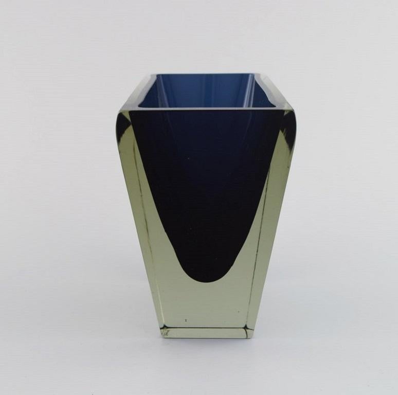 Harry Moilanen (1931-1991) for Nuutajärvi Notsjö. 
Vase in dark blue and clear mouth-blown art glass. 
Finnish design. Dated 1963.
Measures: 18.5 x 12.5 x 7.5 cm.
In excellent condition.
Signed and dated.